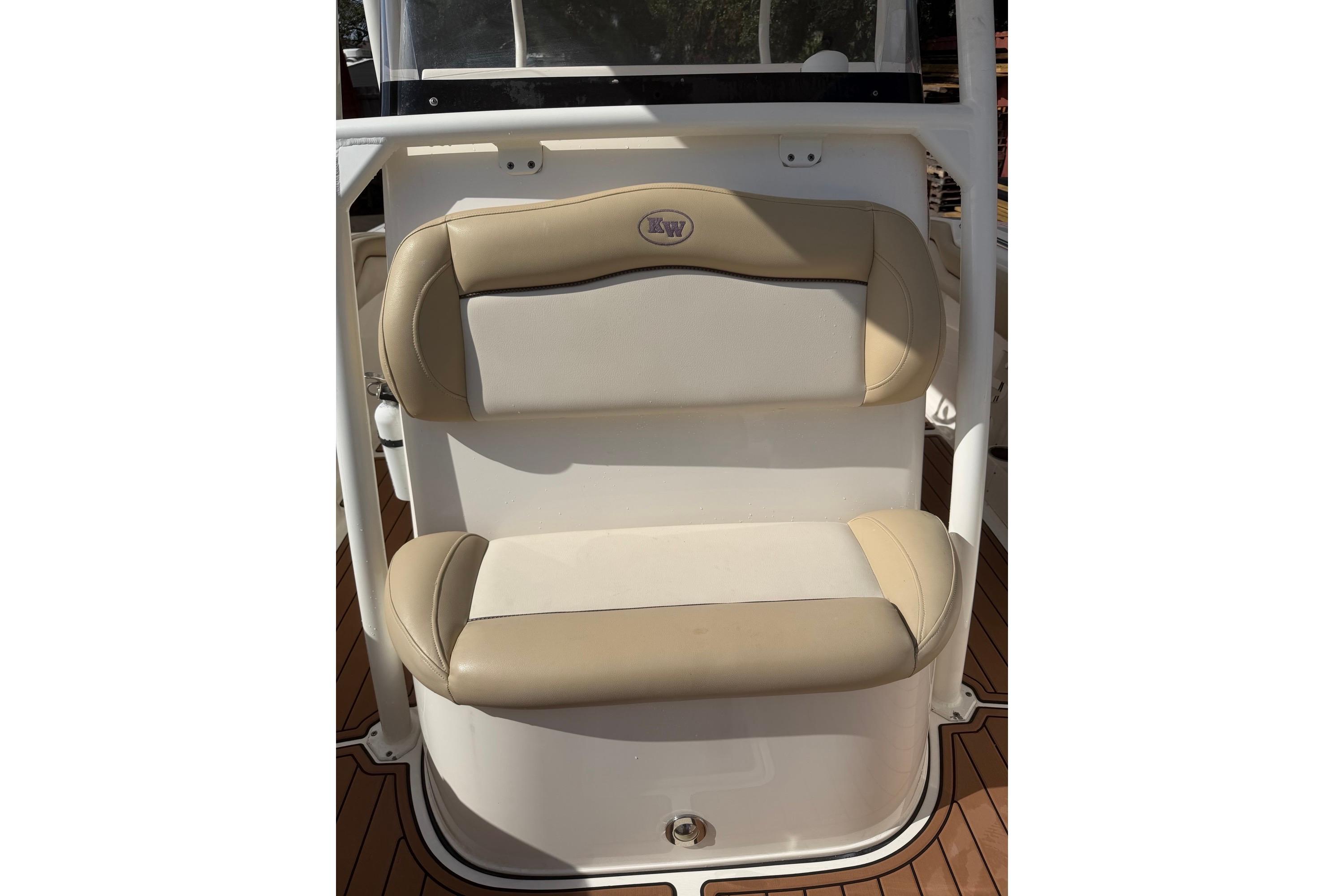 2019 Key West 263 FS boat seat with beige and white upholstery.
