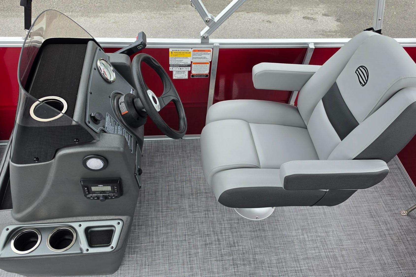 Captain's seat and helm of 2026 Sun Tracker Party Barge 16 DLX pontoon boat.
