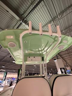 2024 Sea Pro 259 Sport boat with green T-top and rod holders.