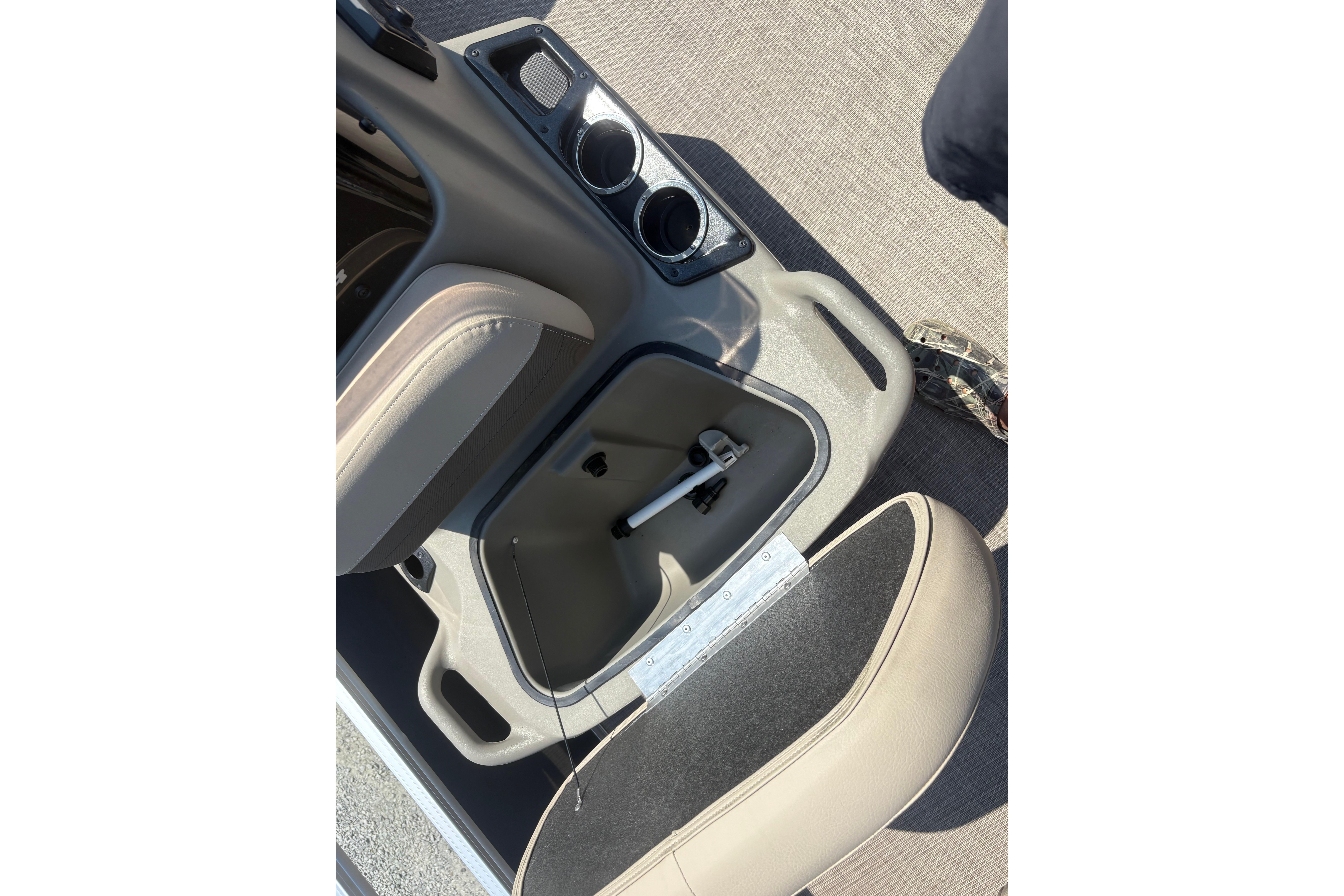 2024 Sun Tracker Bass Buggy 16 DLX interior storage compartment with cup holders.