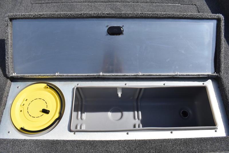 2026 Lowe Skorpion 17 boat storage compartment with open lid and yellow hatch.