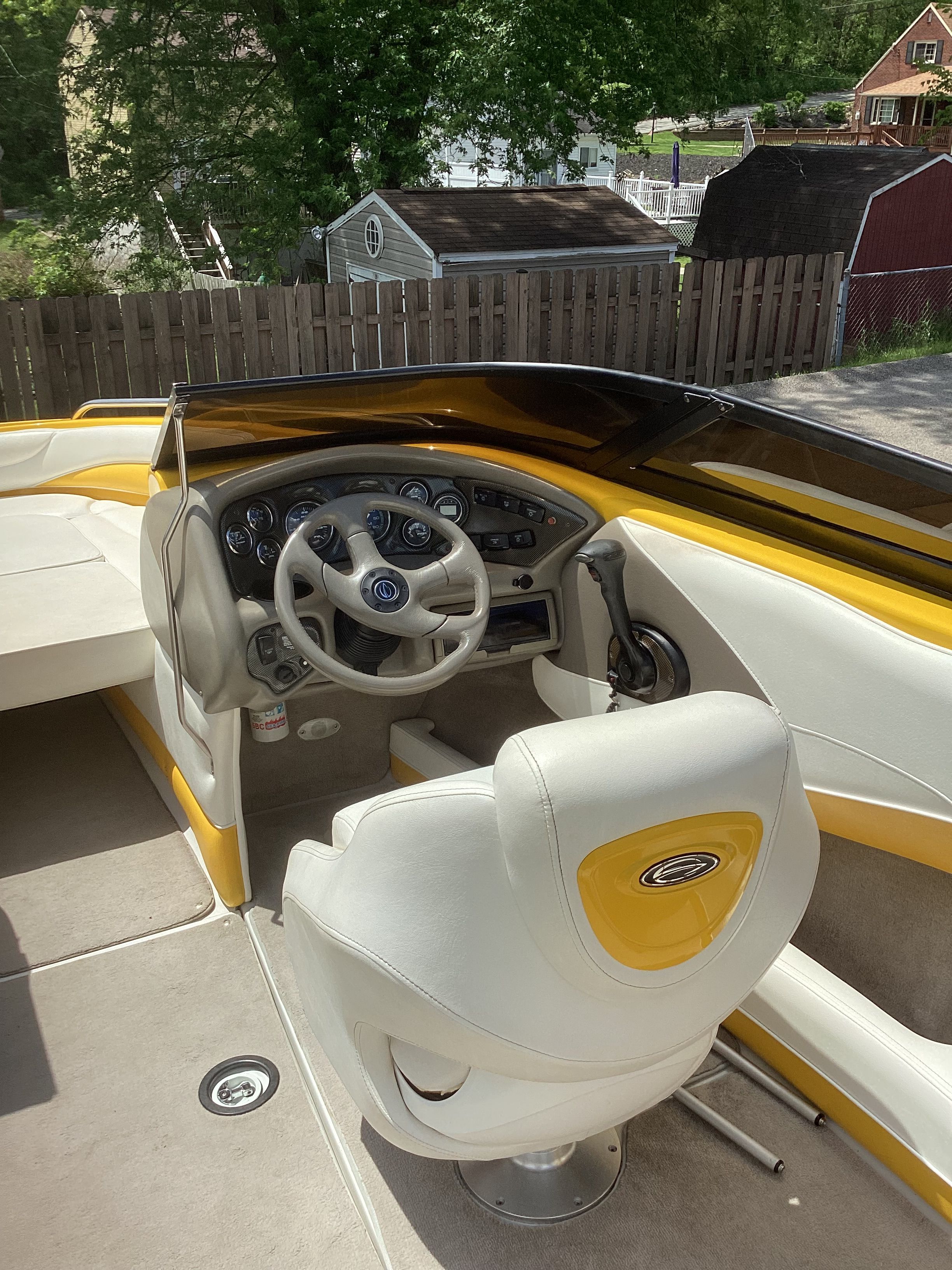 Interior of a 2005 Crownline 202 BR LPX boat with yellow accents.