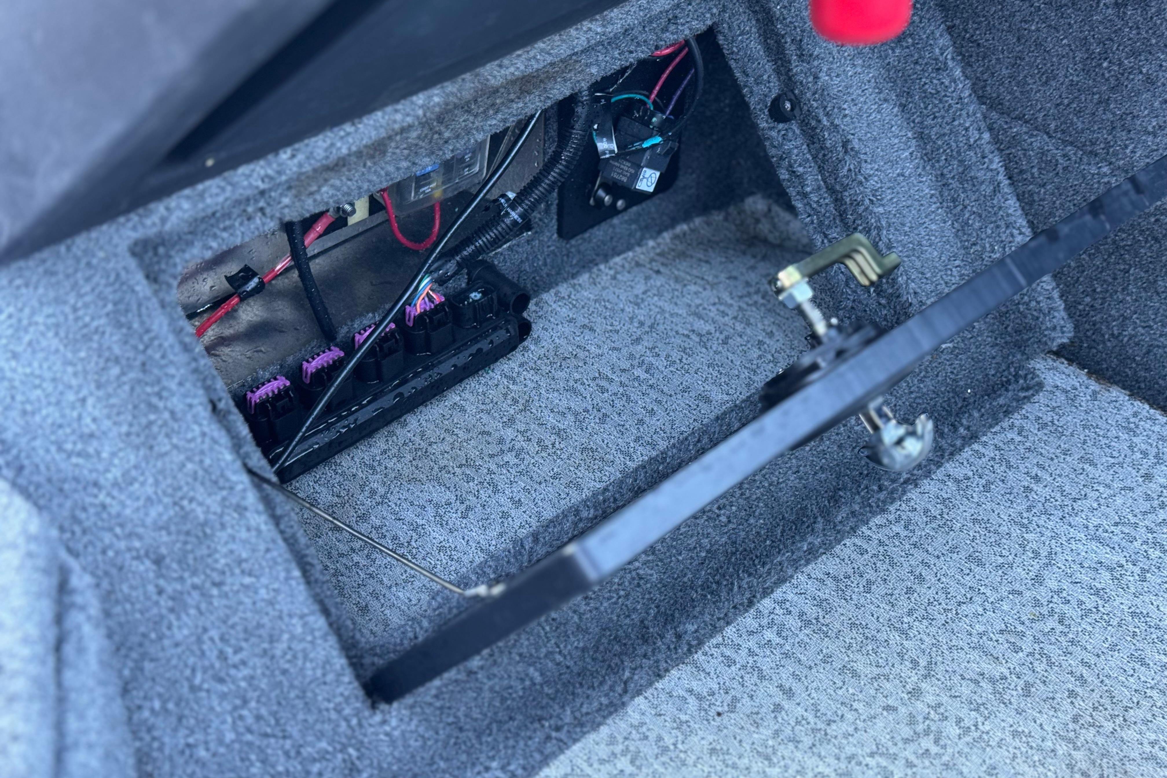 2023 Tracker Targa V-19 WT boat interior wiring compartment with visible cables and components.