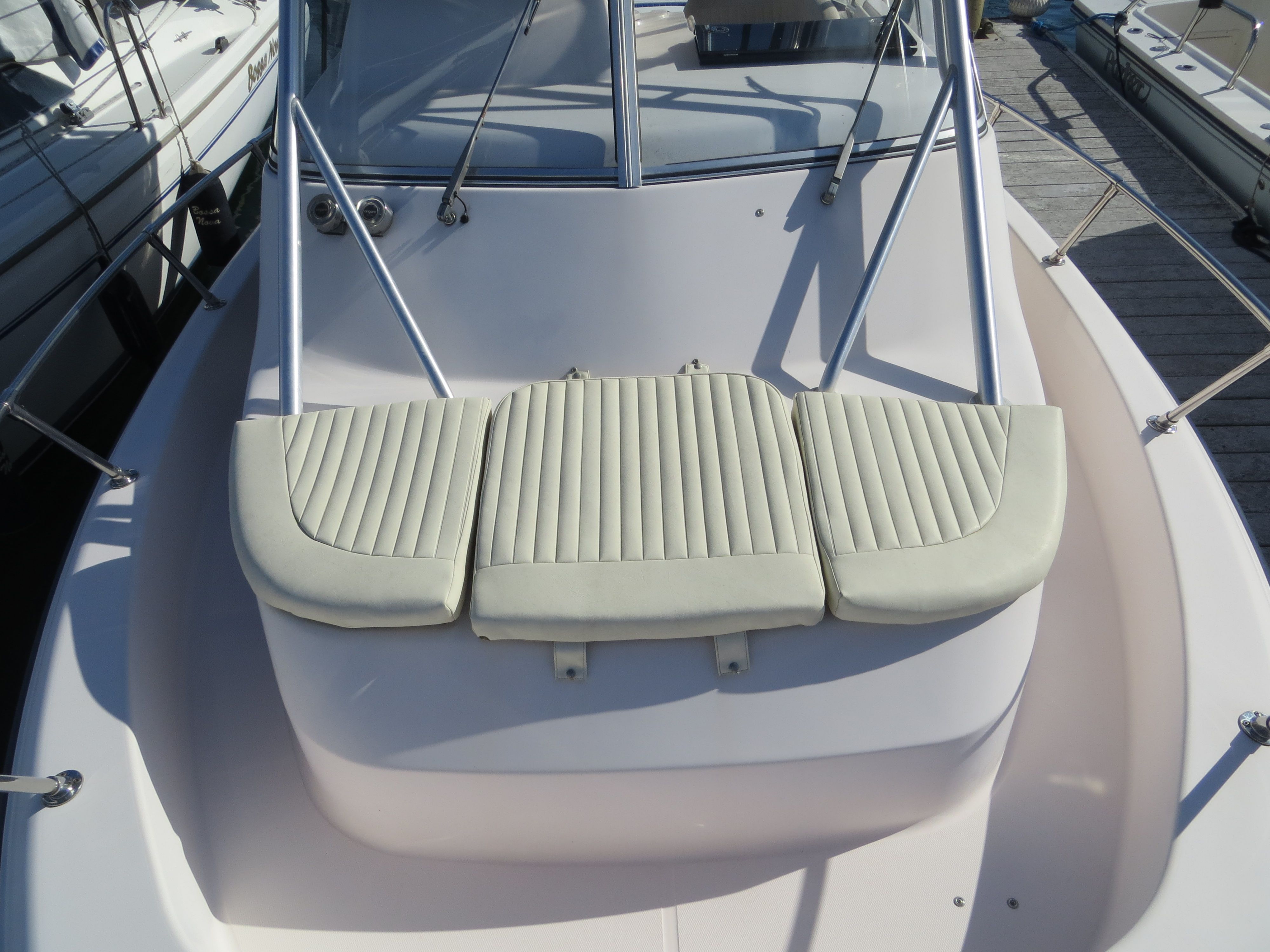 The image shows the bow of a Grady-White Sailfish 282 boat with cushioned seating.