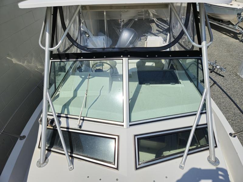 1990 Grady-White 230 Gulfstream boat with windshield and canopy, viewed from above.