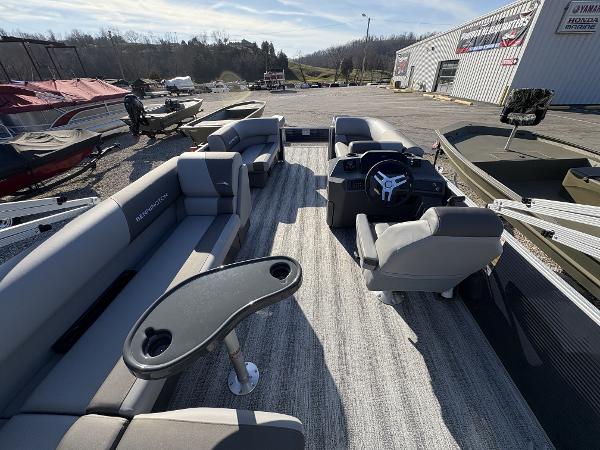 2025 Bennington 21 SLBF pontoon boat interior with seating and steering console.