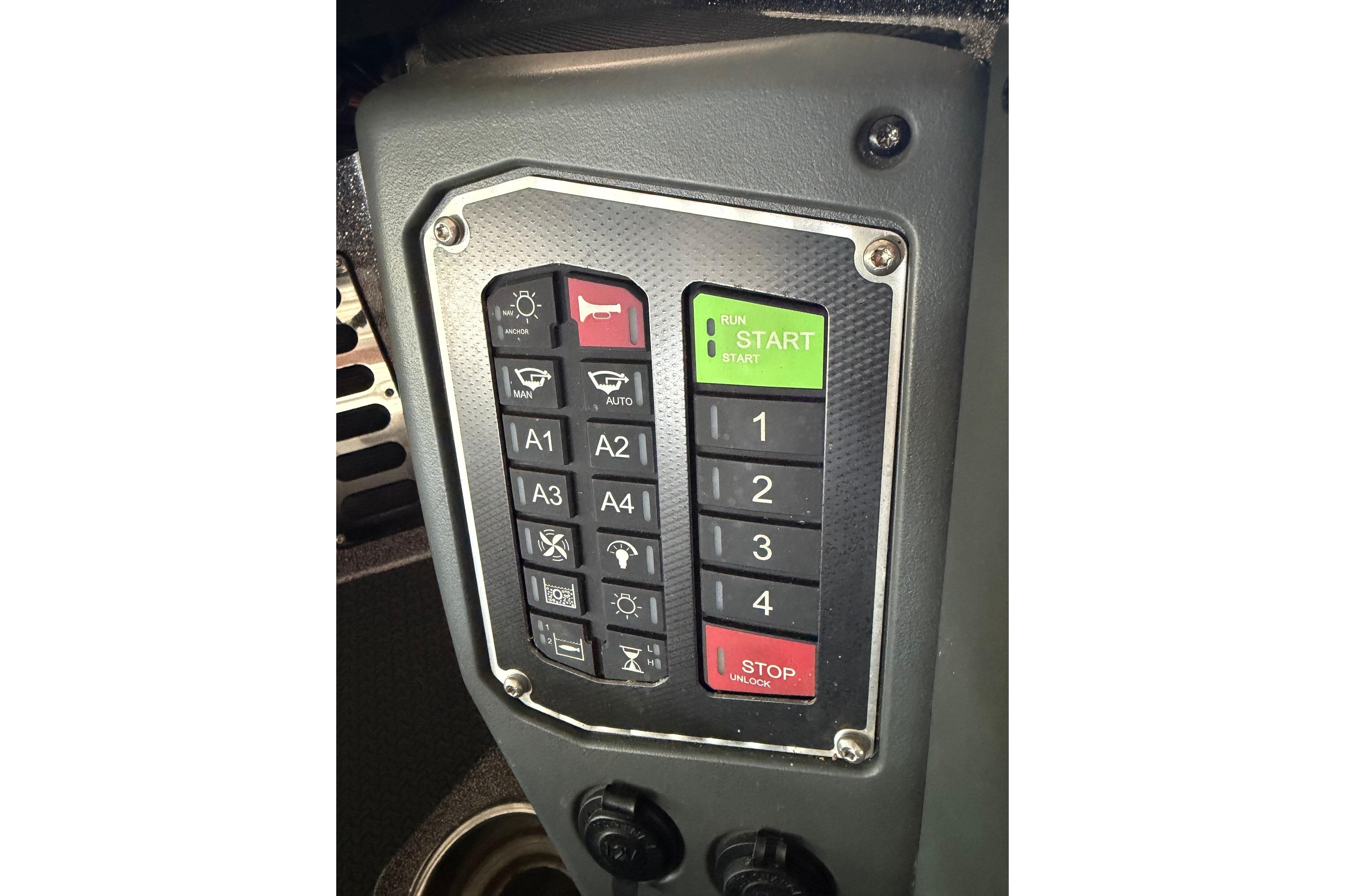 Control panel of a 2020 Ranger Z520L boat with various buttons and switches.