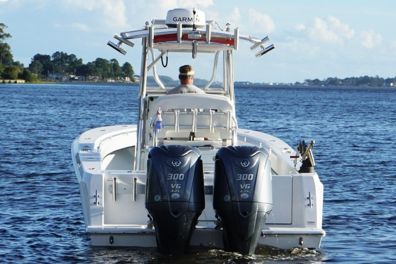 2023 Contender 30 Tournament boat with dual Yamaha 300 V6 engines on open water.
