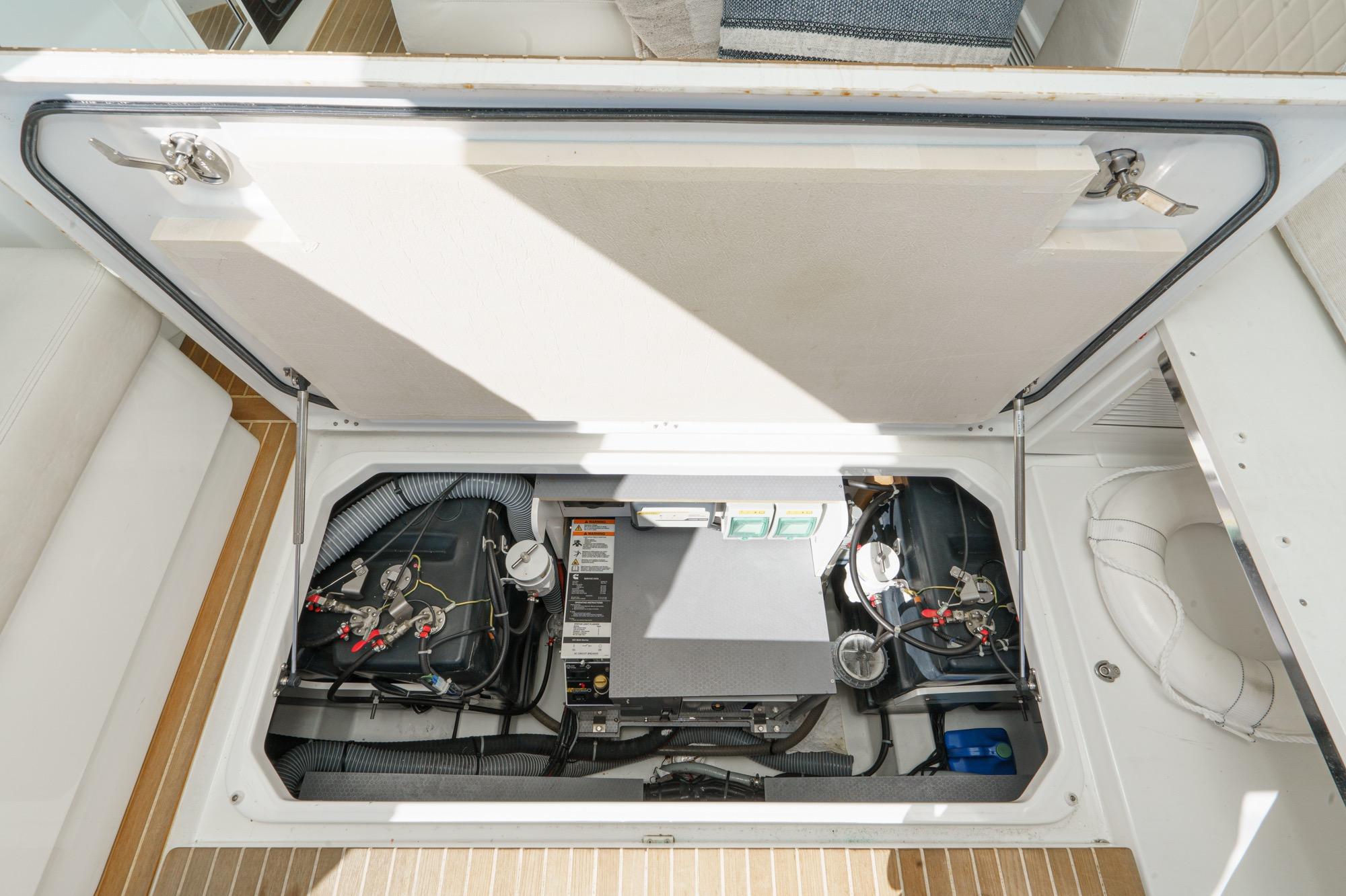 Engine compartment of 2018 Beneteau Gran Turismo 40, showcasing mechanical components and wiring.