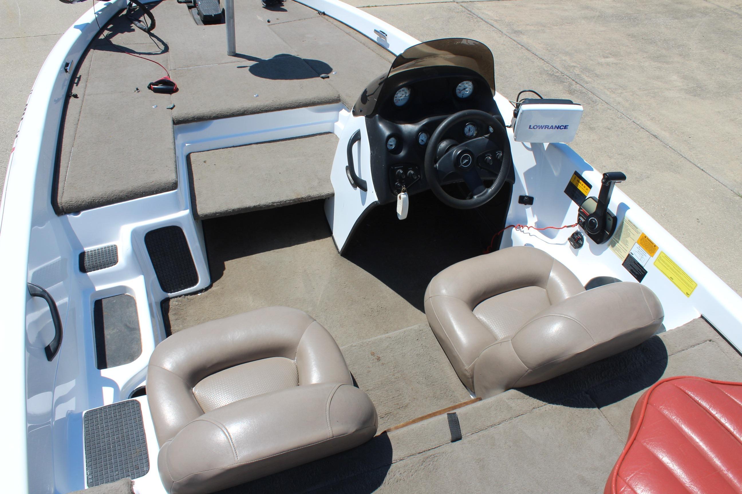 2003 Nitro NX 750 SC boat interior with steering wheel and seating.