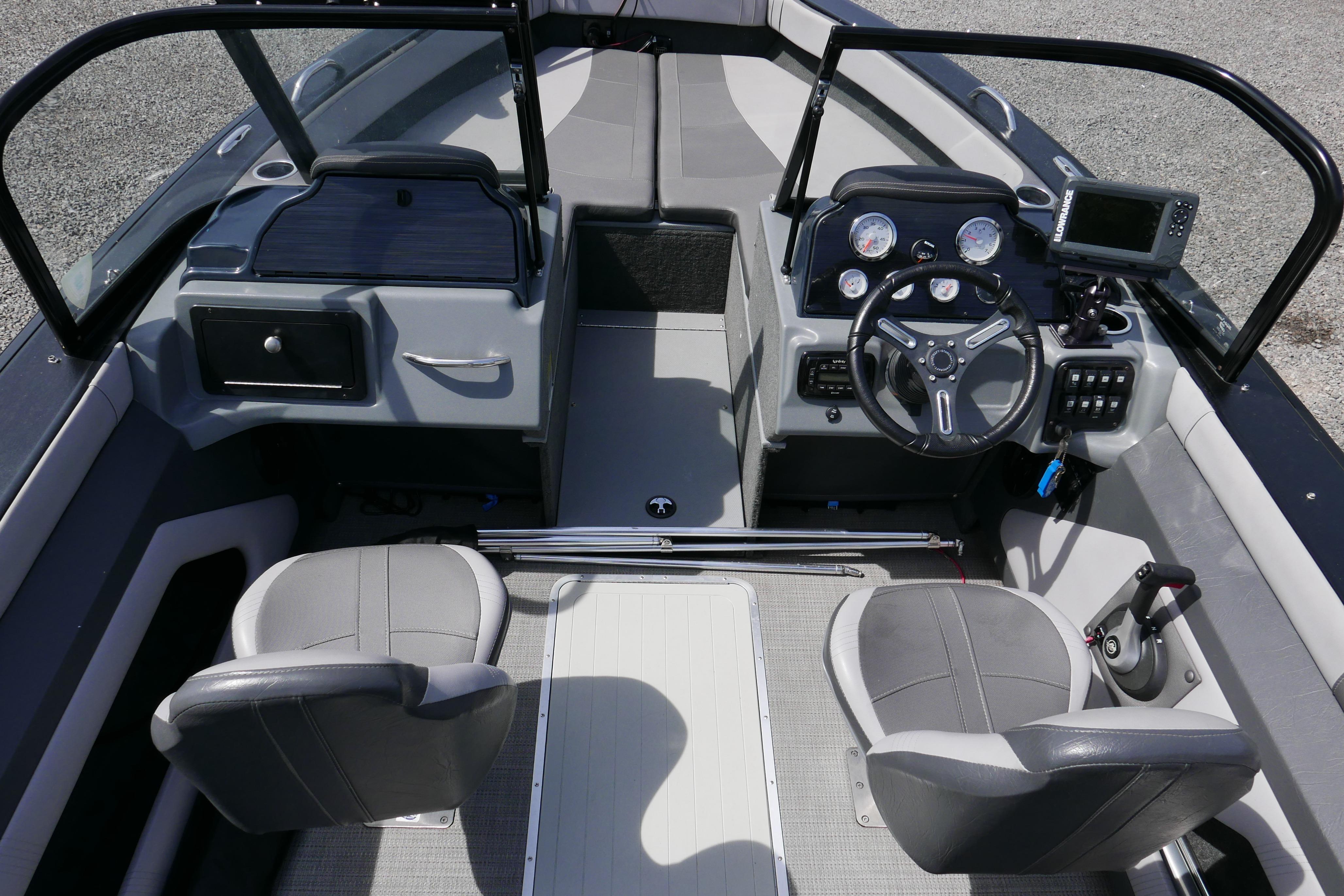 2016 Starcraft Titan 186 boat interior with steering wheel, seats, and control panel.