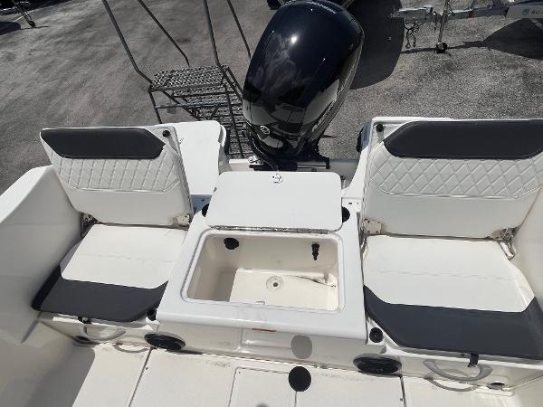 2022 Bayliner Trophy T22CC boat interior with seating and motor, featuring modern design.
