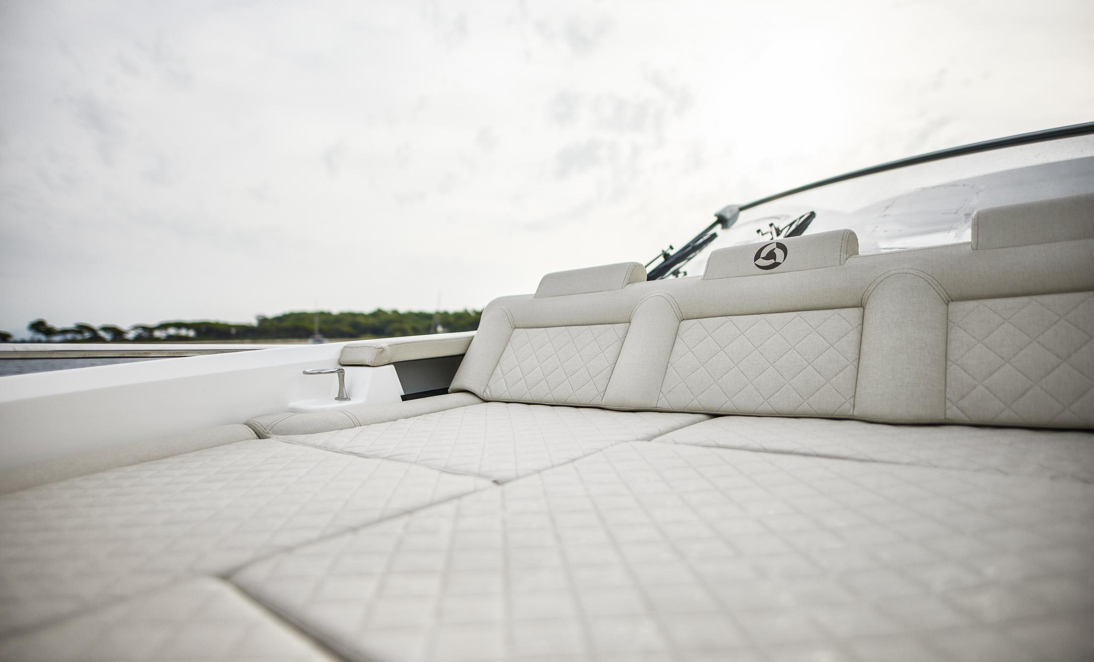 Luxurious seating on 2025 Skamander Sorrento boat with quilted upholstery.
