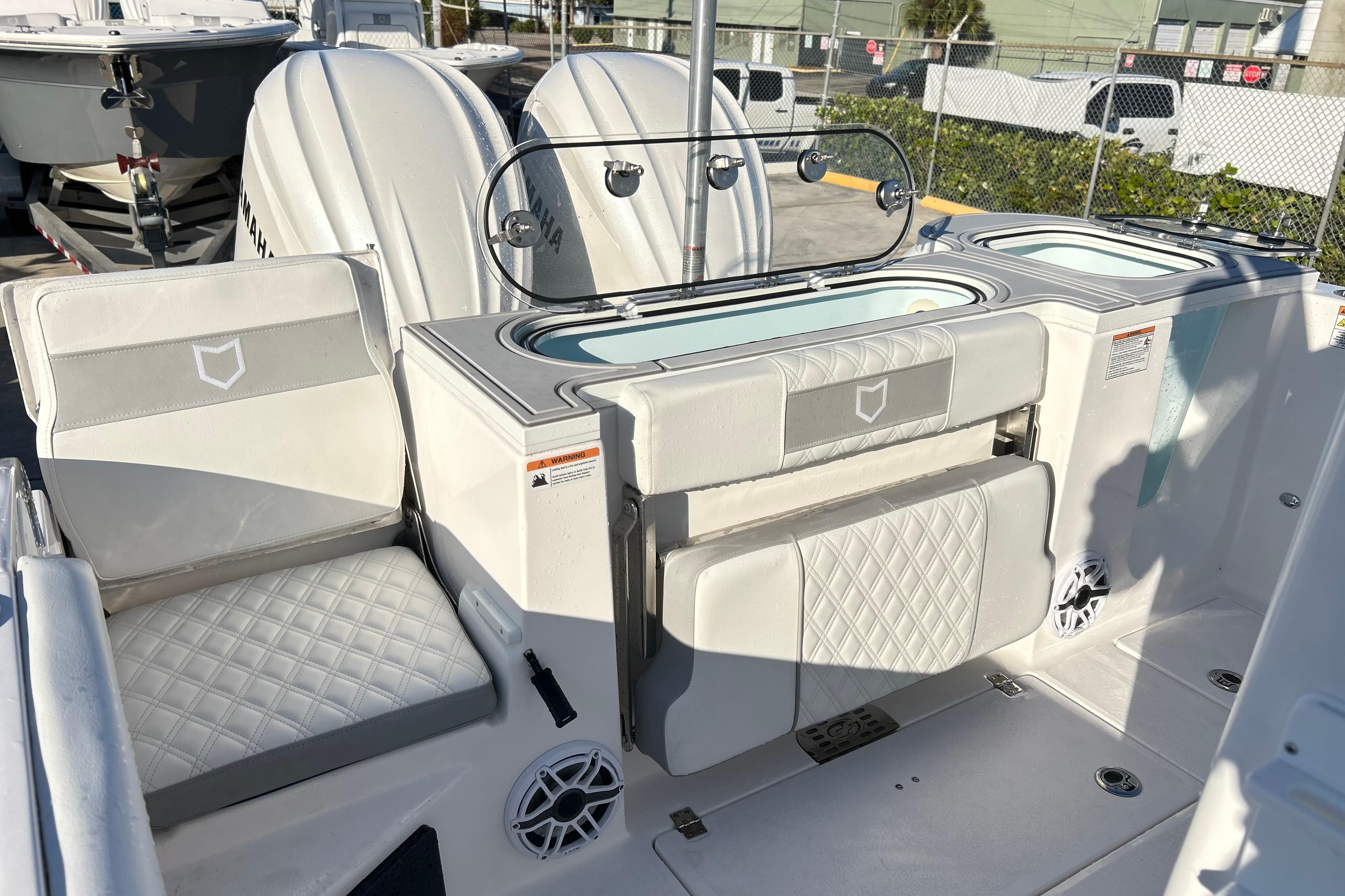 2026 Sea Fox 288 Commander boat interior with seating and storage compartments.