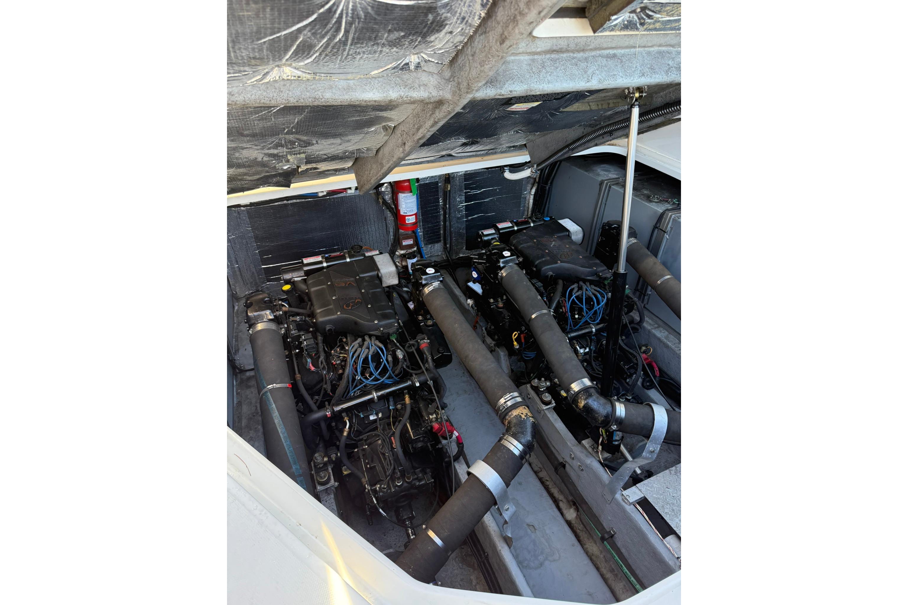 Engine compartment of a 2000 Sea Ray 410 Express Cruiser, showcasing dual engines.