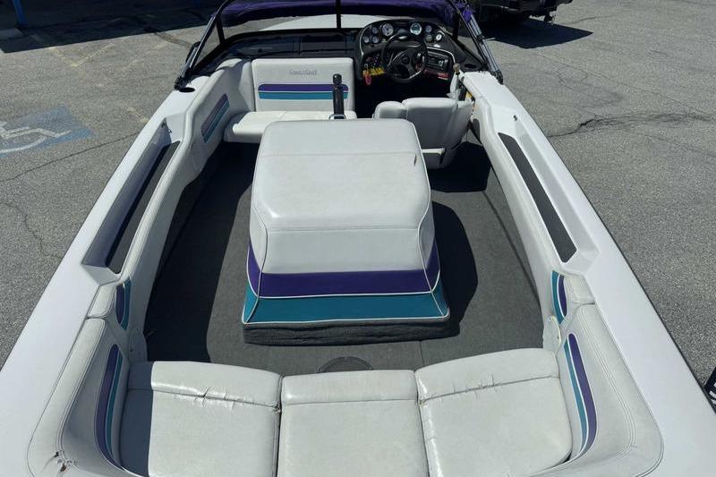 1995 Correct Craft Ski Nautique boat interior with white seating and dashboard.