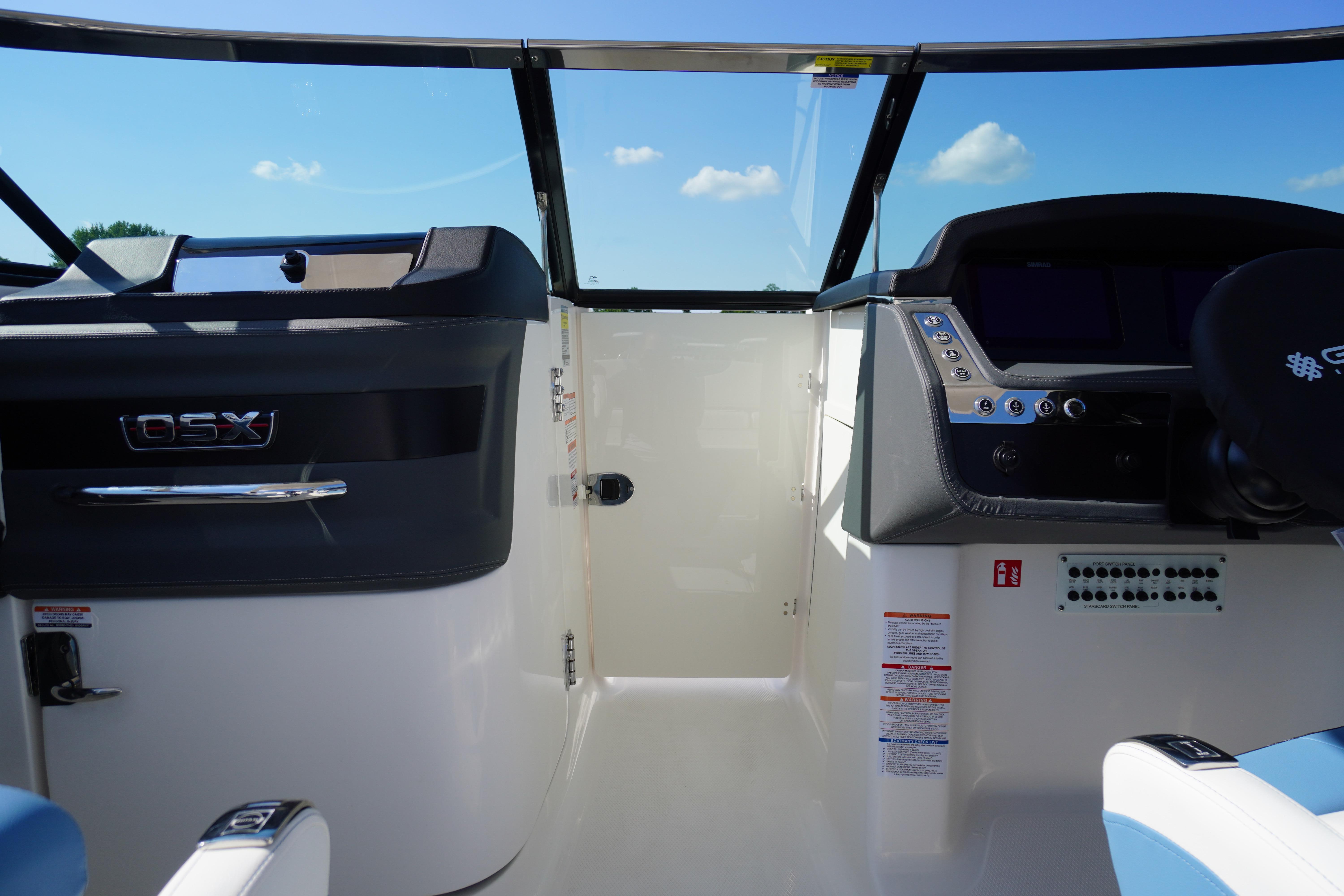 Interior view of 2026 Chaparral 270 OSX boat cockpit with modern controls and dashboard.