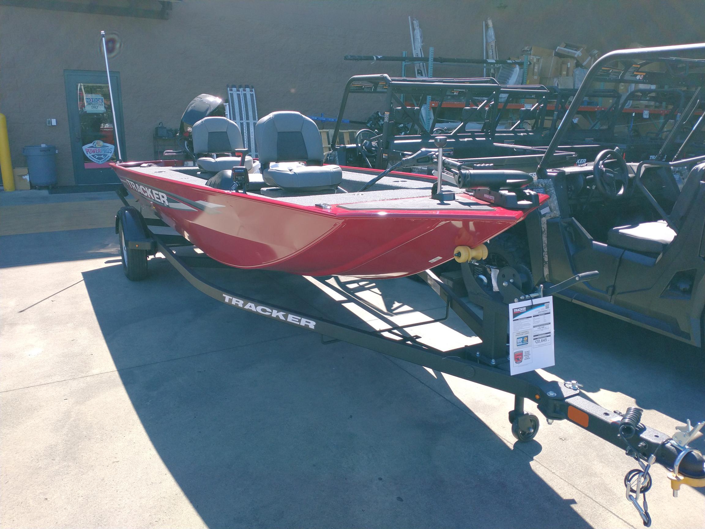 2025 Tracker Panfish 17 boat in red on a trailer, displayed outdoors.