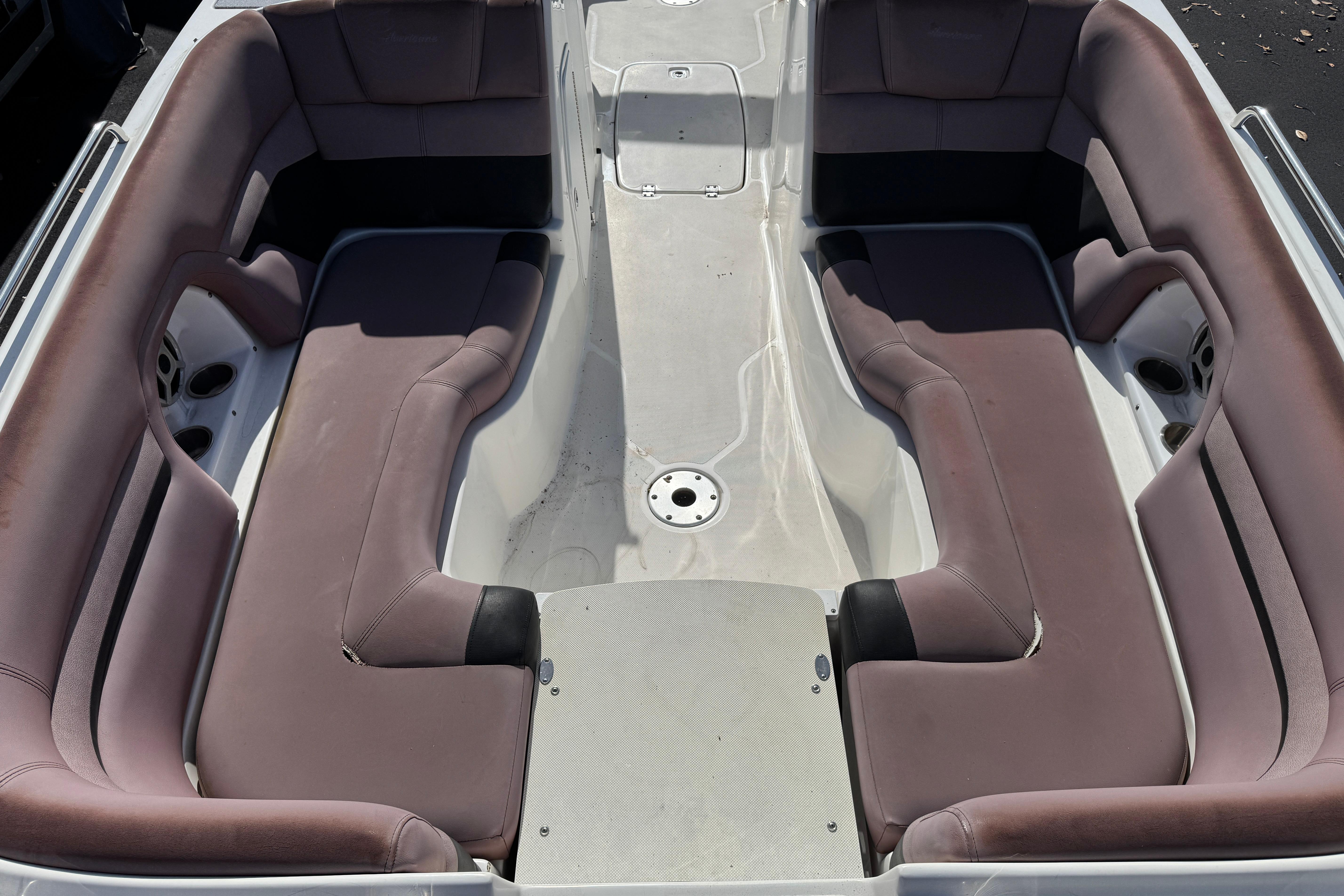 2018 Hurricane SunDeck 2400 OB boat interior with spacious seating and cup holders.