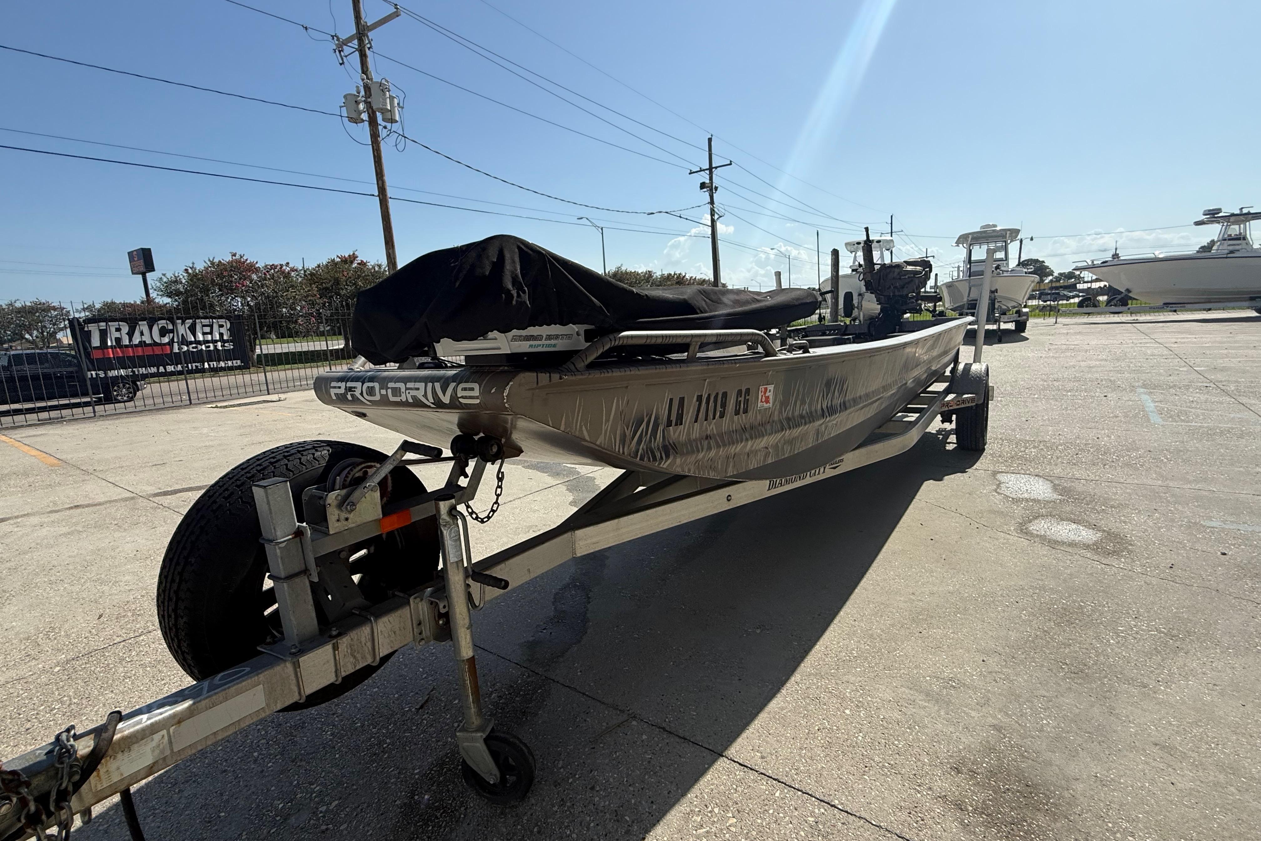 2017 Pro-Drive 2048 boat on trailer in sunny outdoor setting.