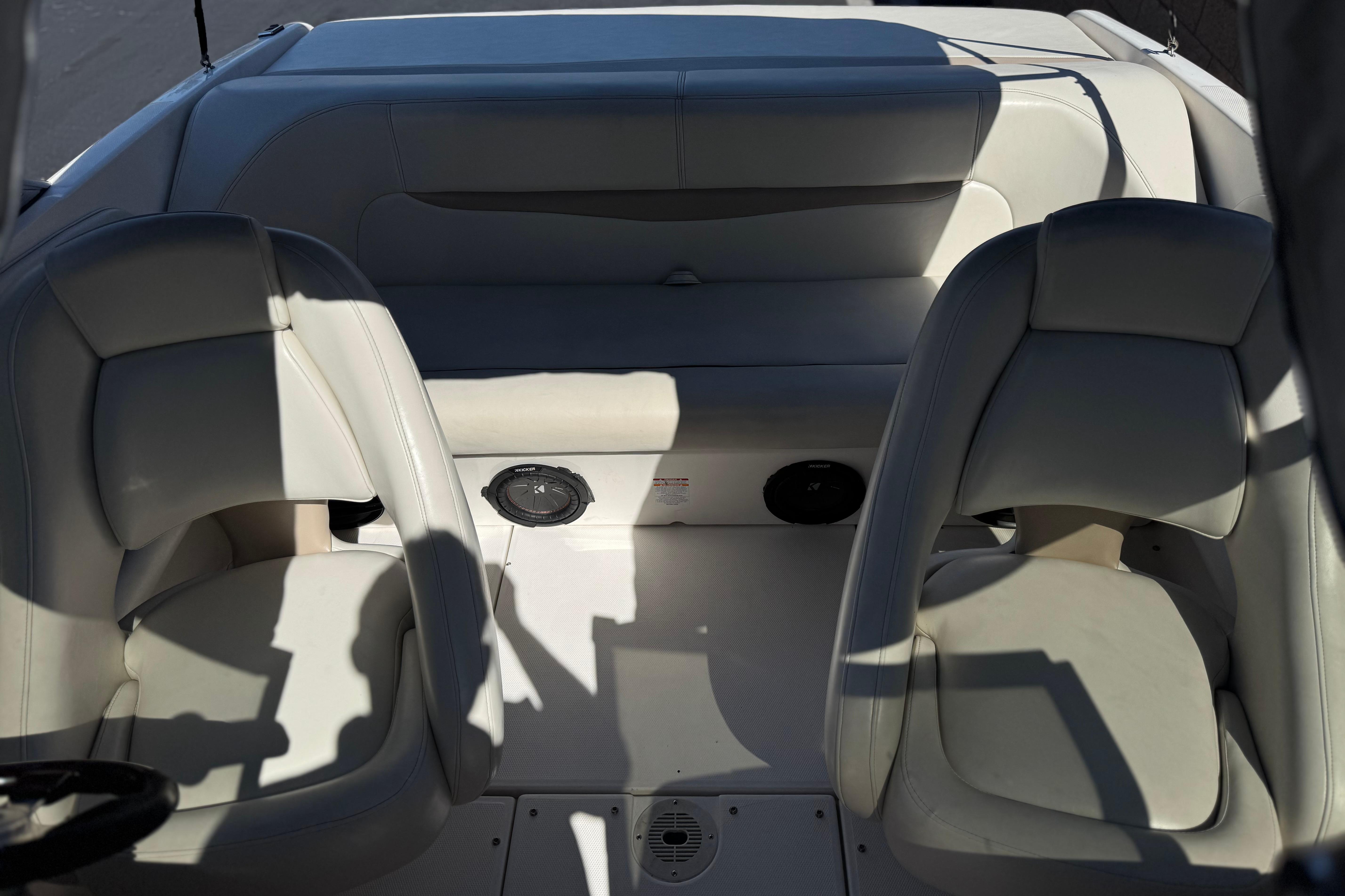 2002 Chaparral 186 SSi boat interior with white seating and speaker system.