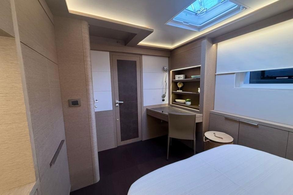 Luxurious interior cabin of 2018 Lagoon SEVENTY 7 yacht with modern furnishings.