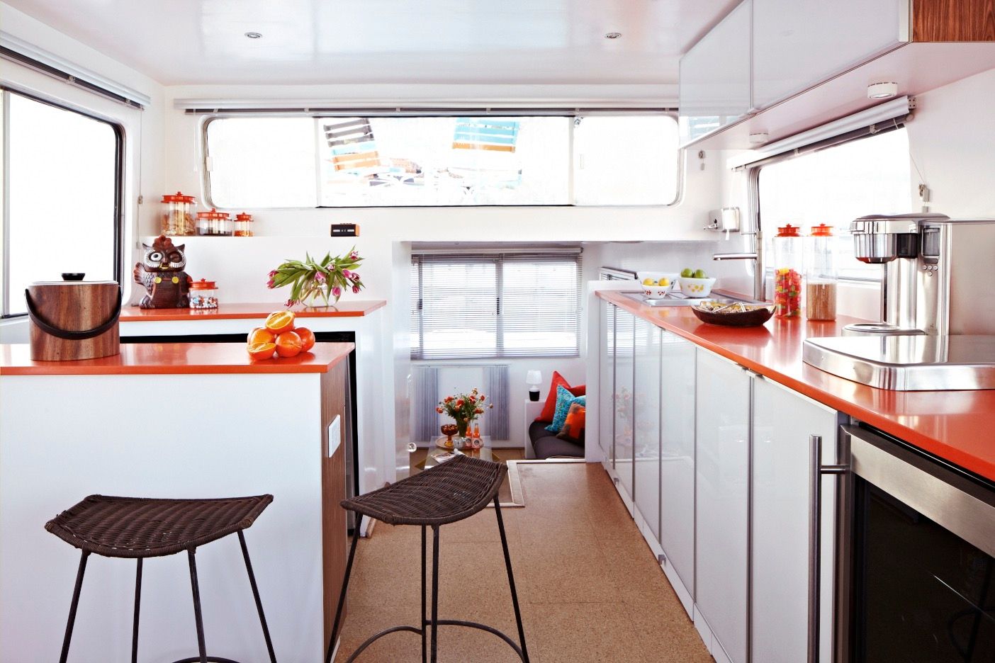 Interior of a 1975 Harbor Master houseboat with modern kitchen and seating area.