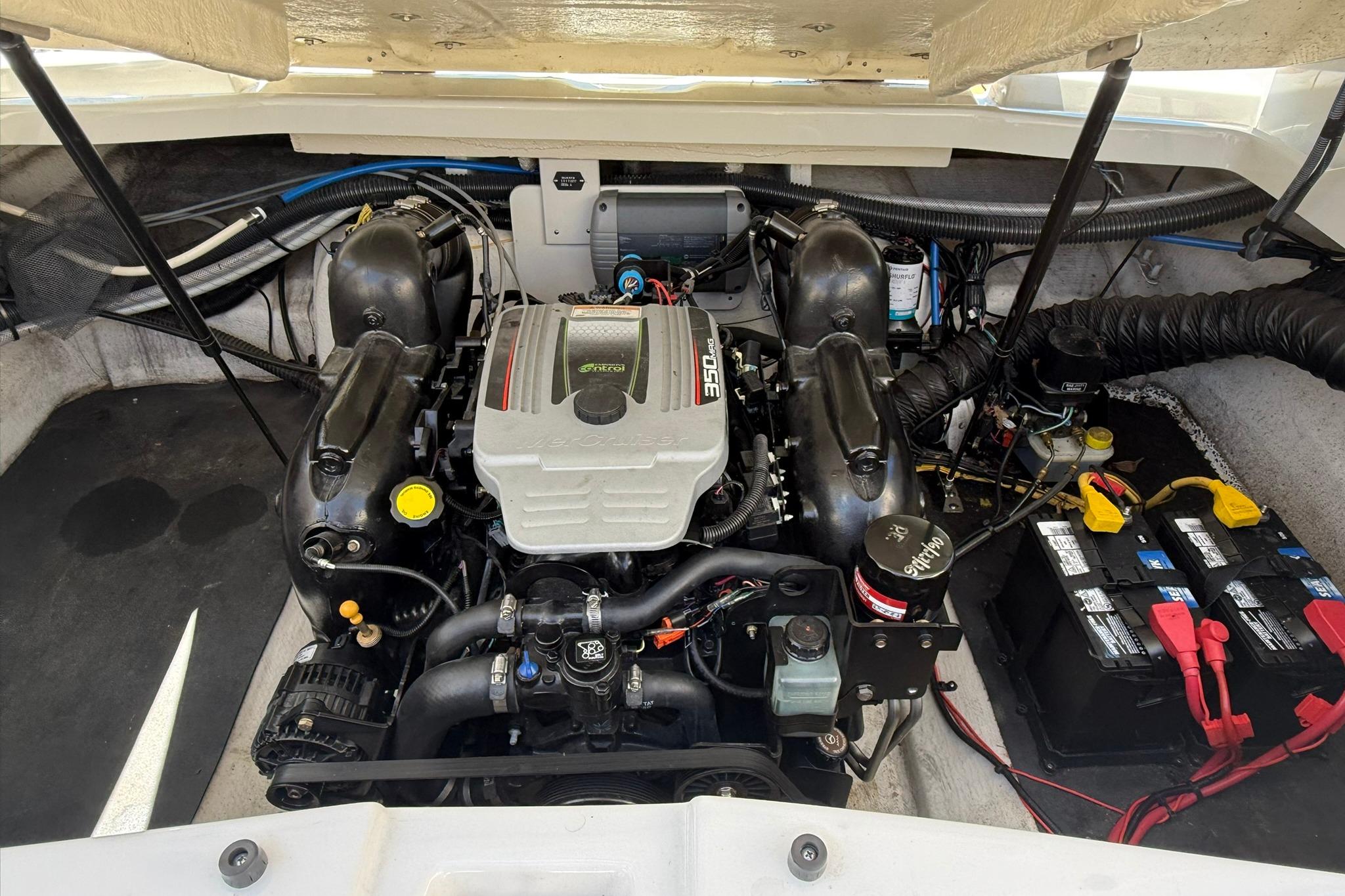 Engine compartment of a 2016 Crownline 255 SS boat, featuring a 350 MAG engine.