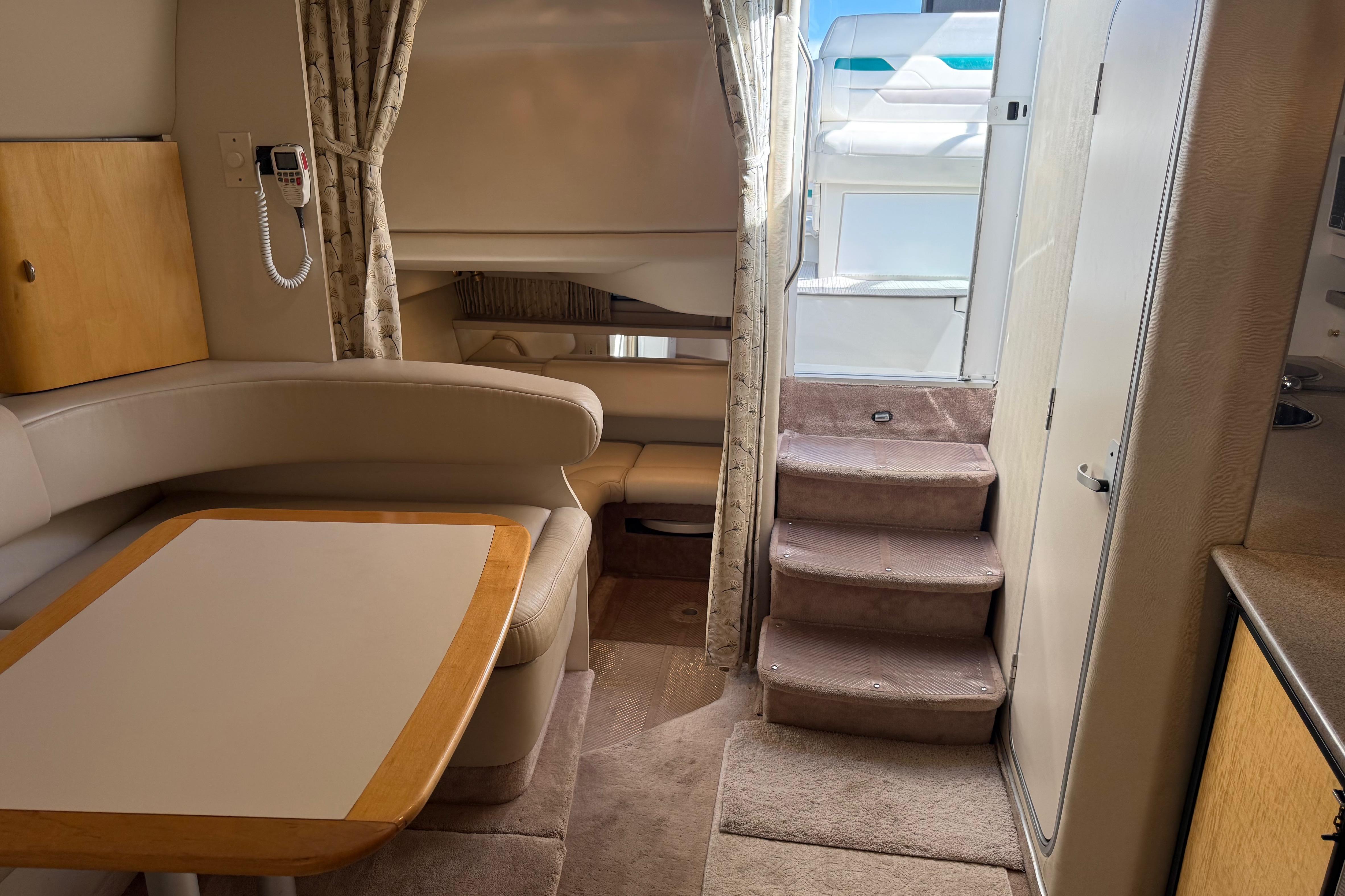 Interior of a 1999 Formula 34 Performance Cruiser with seating and stairs.