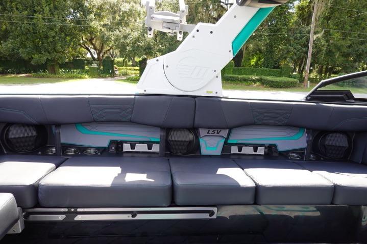 2022 Malibu Wakesetter 25 LSV interior seating with cup holders and speakers.