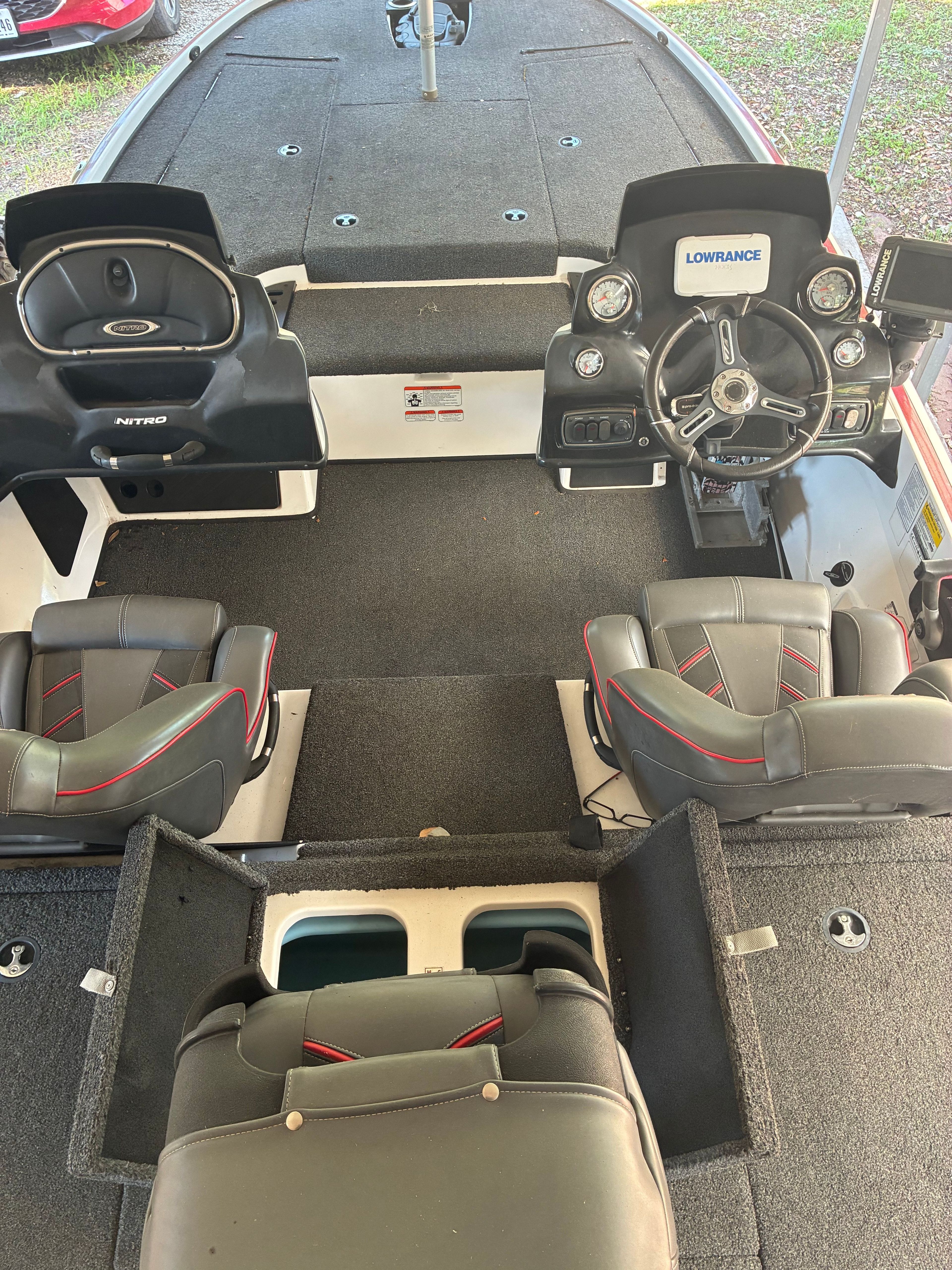 Interior view of a Nitro Z18 boat with four seats and a steering console.