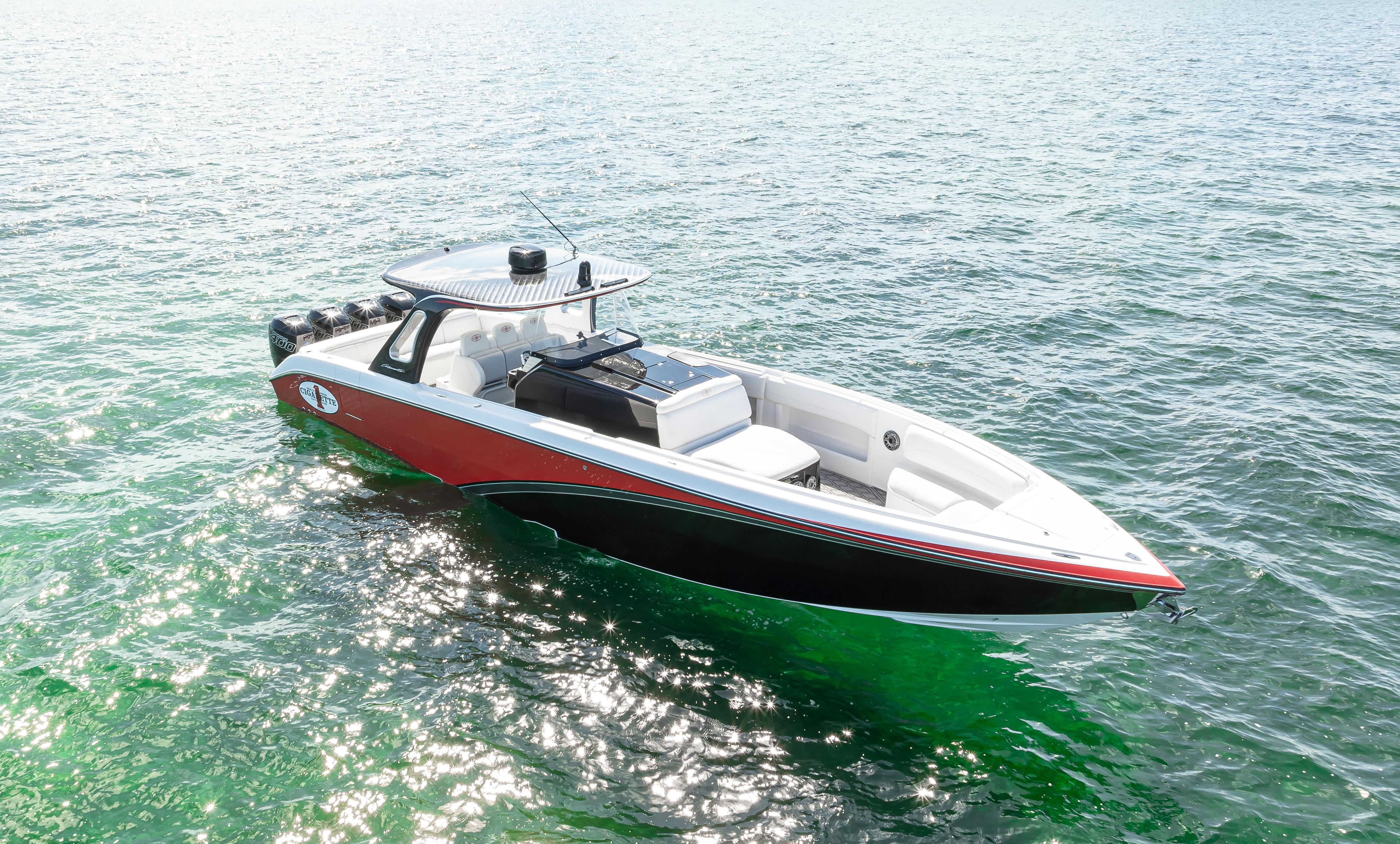 2016 Cigarette 41 GTR boat on clear water, showcasing sleek design and vibrant colors.