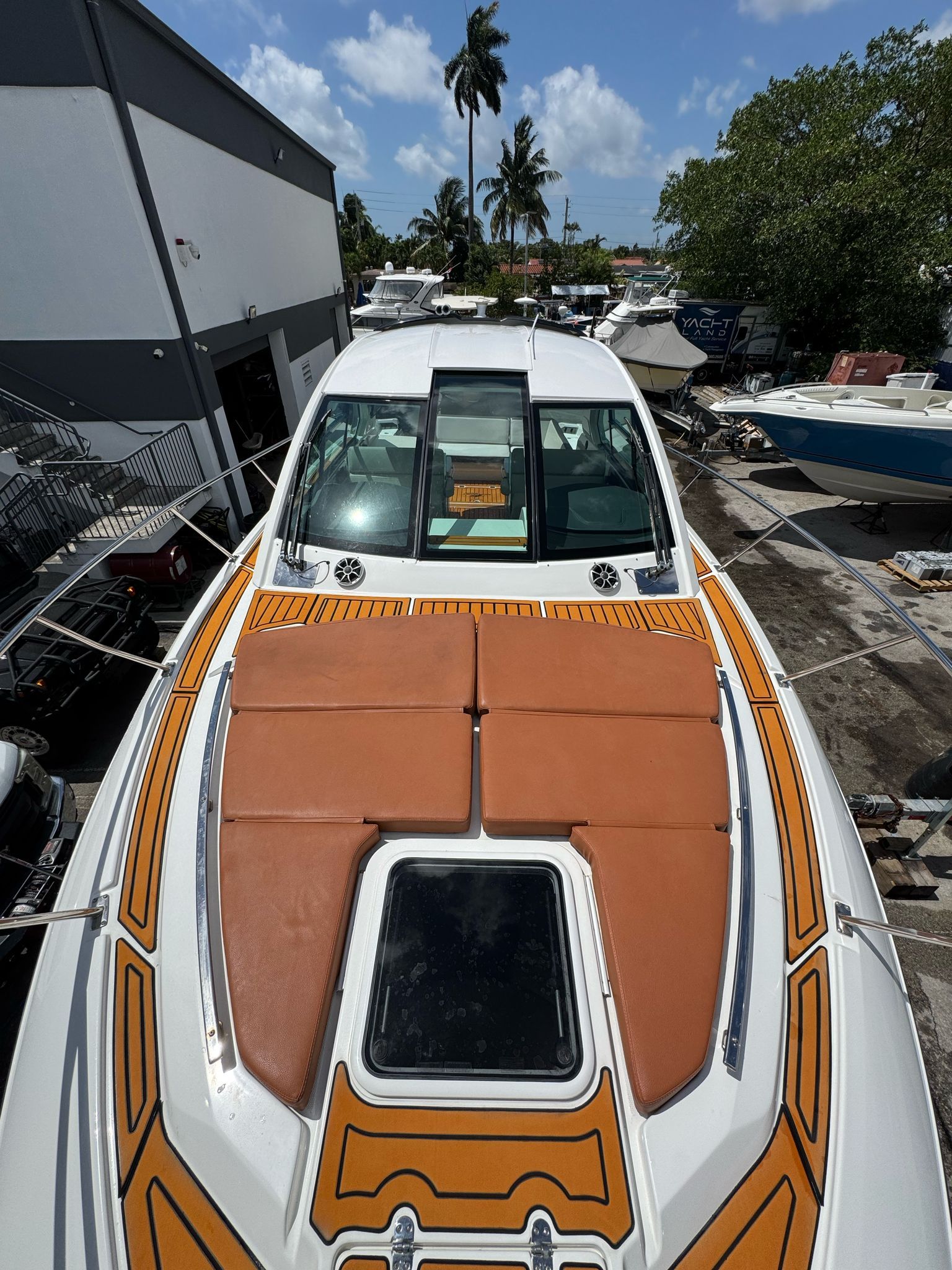 2015 Monterey 360 Sport Coupe on a sunny boatyard.