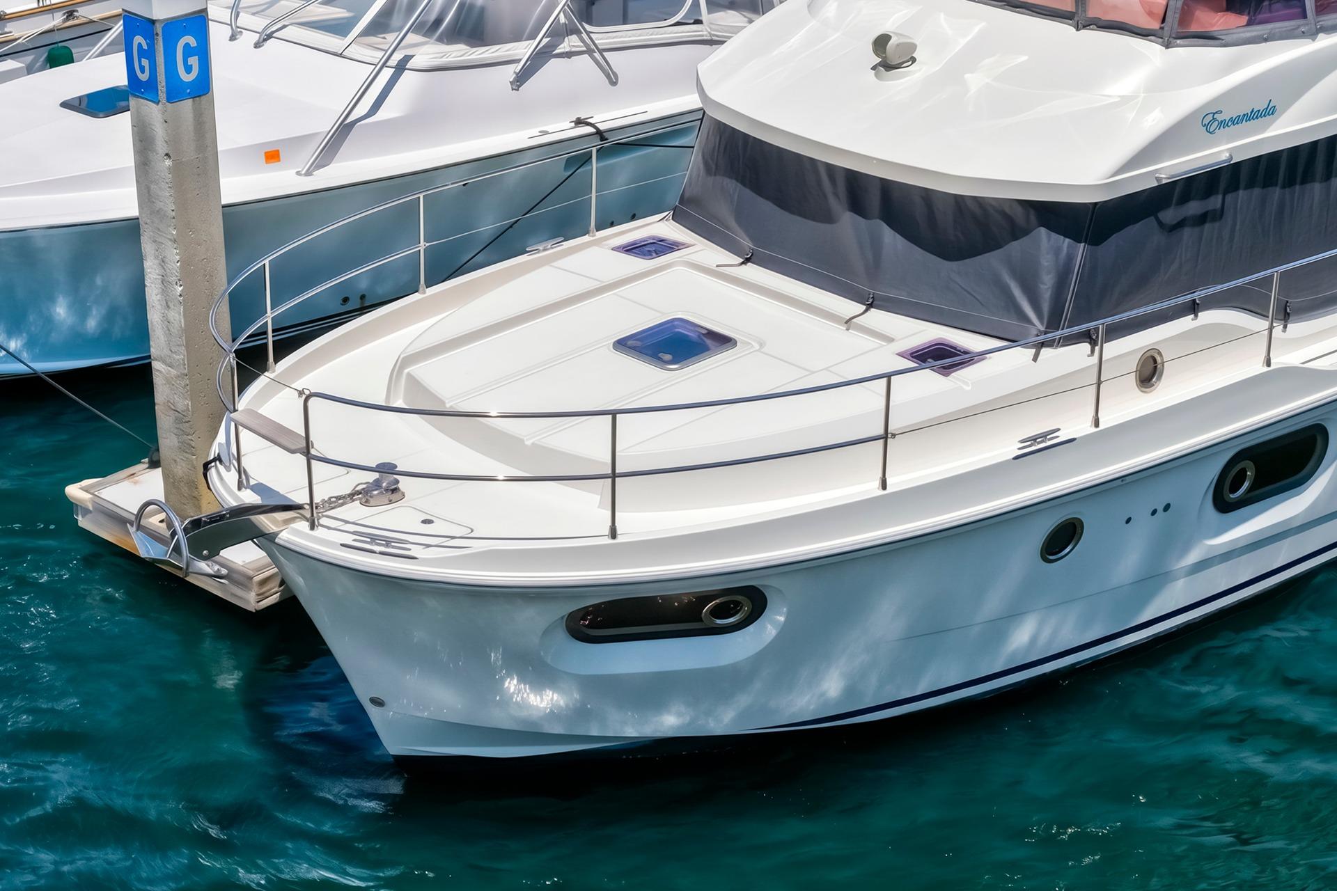 2022 Beneteau Swift Trawler 41 Fly docked in marina, showcasing sleek design.
