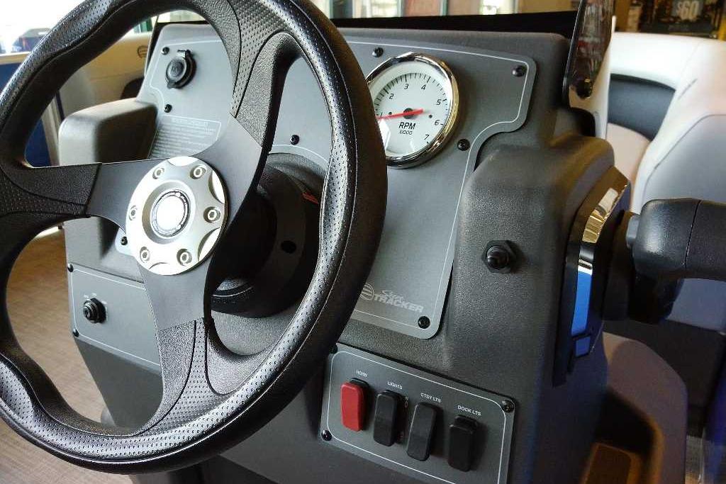 Steering console of 2026 Sun Tracker Party Barge 16 DLX with RPM gauge.