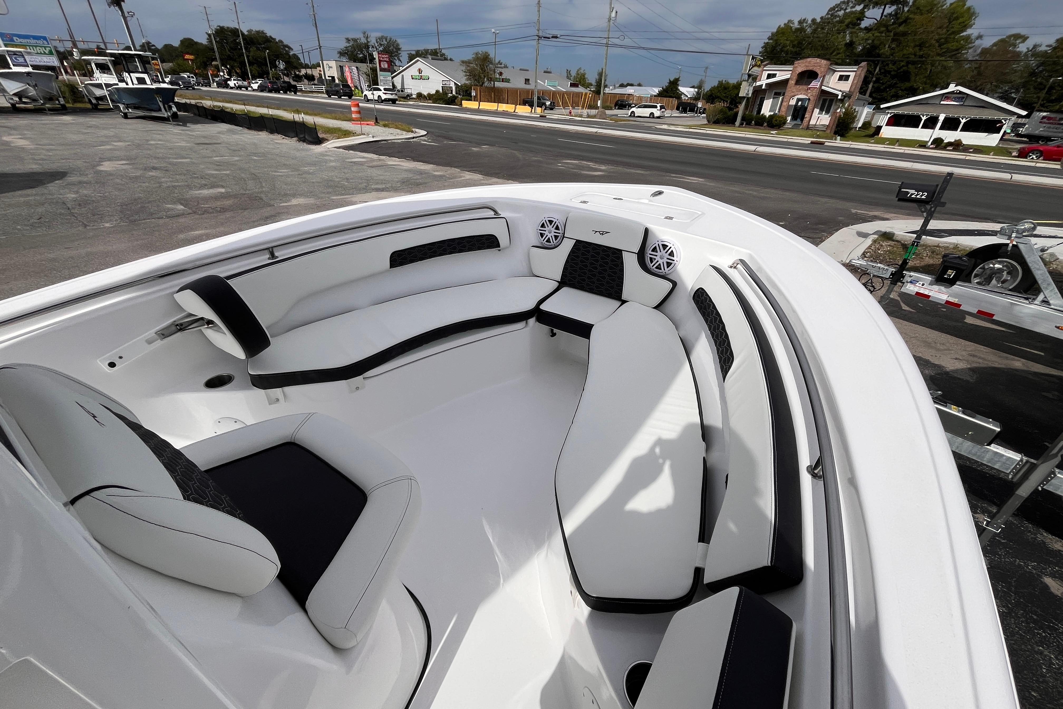 2026 Tidewater 220 LXF boat interior with white seating and black accents.