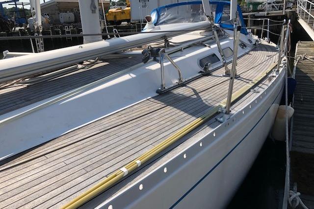 1999 Sweden Yachts 45 sailboat docked, showcasing sleek deck design and nautical features.