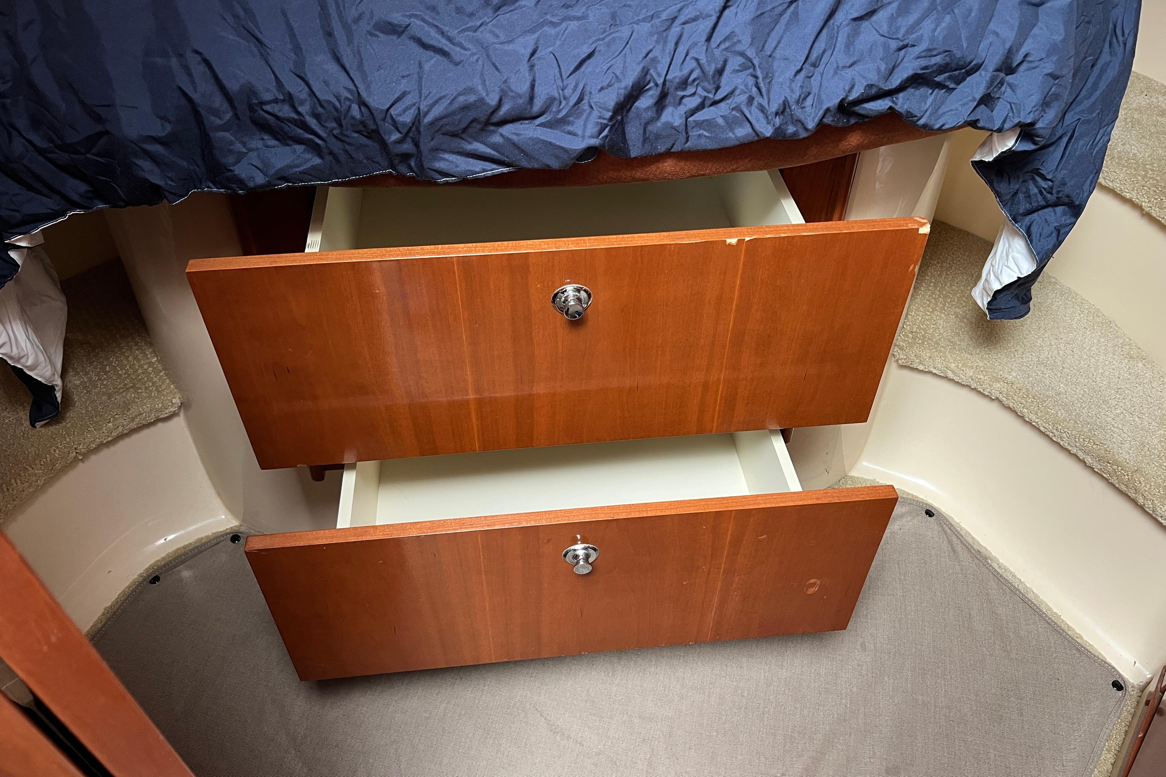 Wooden drawers under bed in 2007 Meridian 391 Sedan interior.