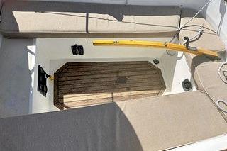1987 Morris Linda boat interior with wooden deck and cushioned seating.