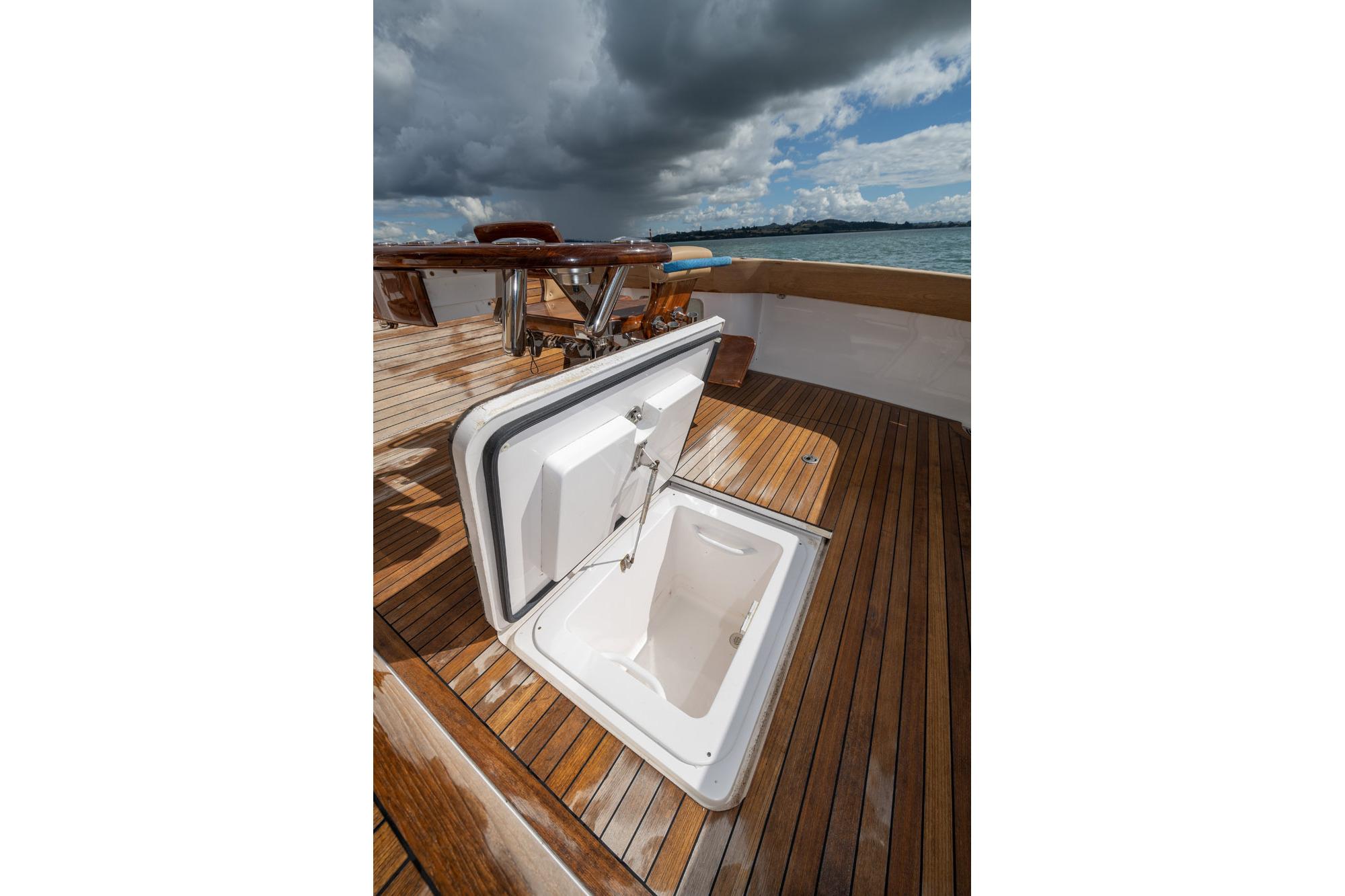 Open hatch on 2007 Viking 64 Convertible yacht deck under cloudy sky.