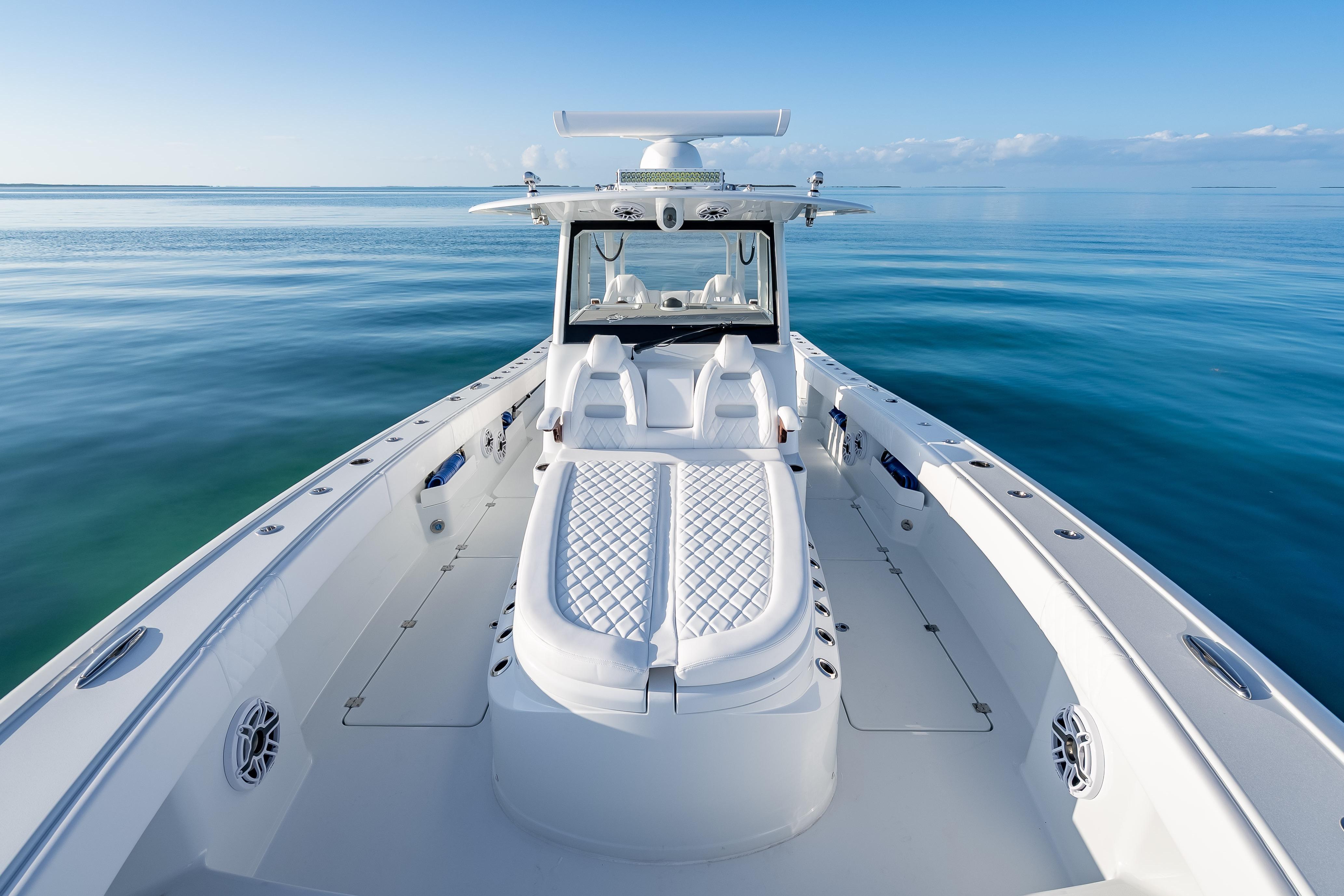 2026 Freeman 35 boat on calm ocean, showcasing sleek design and luxury seating.