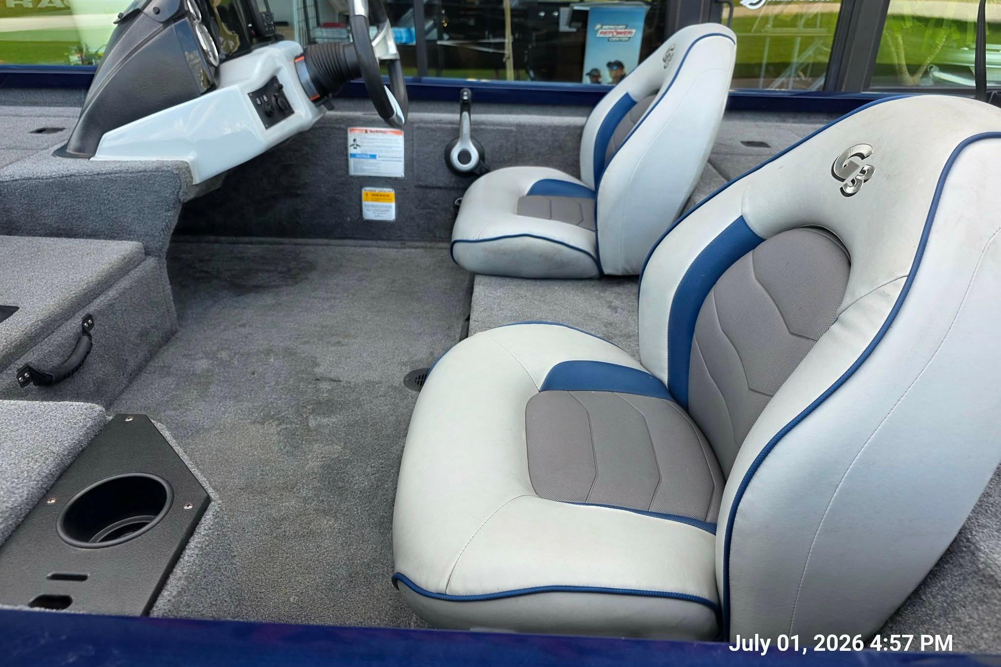 2017 G3 Sportsman 18 boat interior with gray and blue seating.