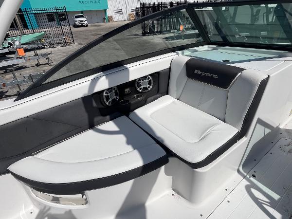 2018 Bryant Speranza boat interior with white seating and dashboard controls.