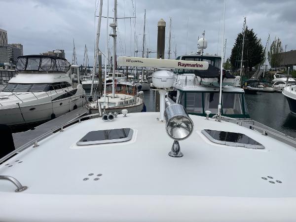 2003 Tiara Yachts 3500 Open docked in a marina, surrounded by other boats.