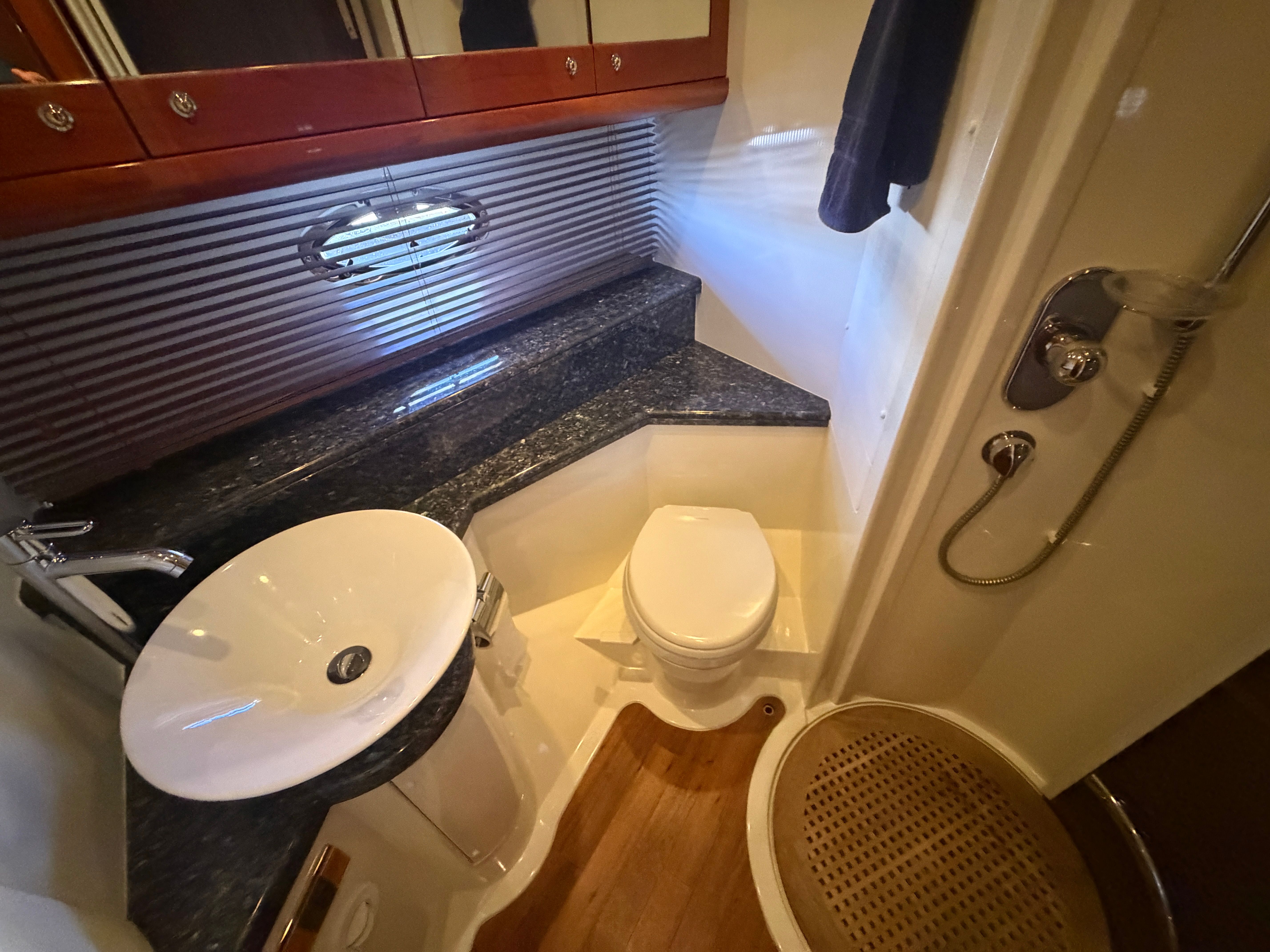 The image shows an elegant bathroom on a 2008 Sunseeker Portofino 53 yacht.