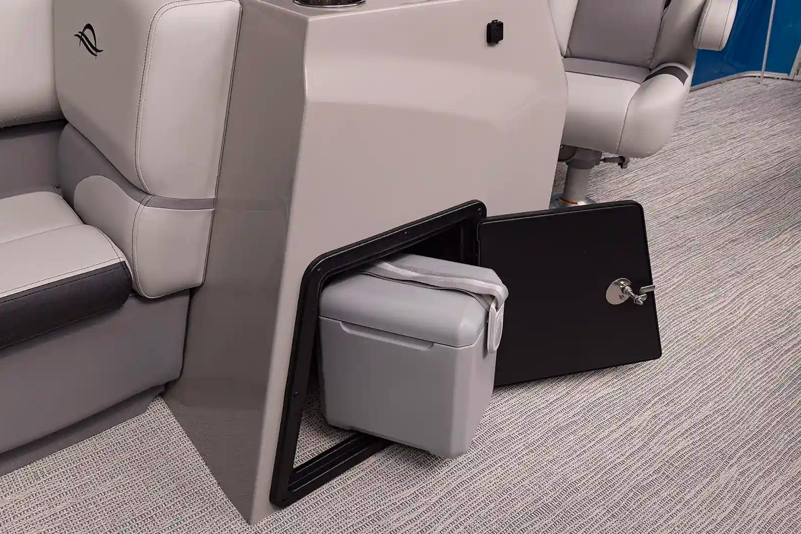 Interior of SunCatcher Select 322SL boat with storage compartment.