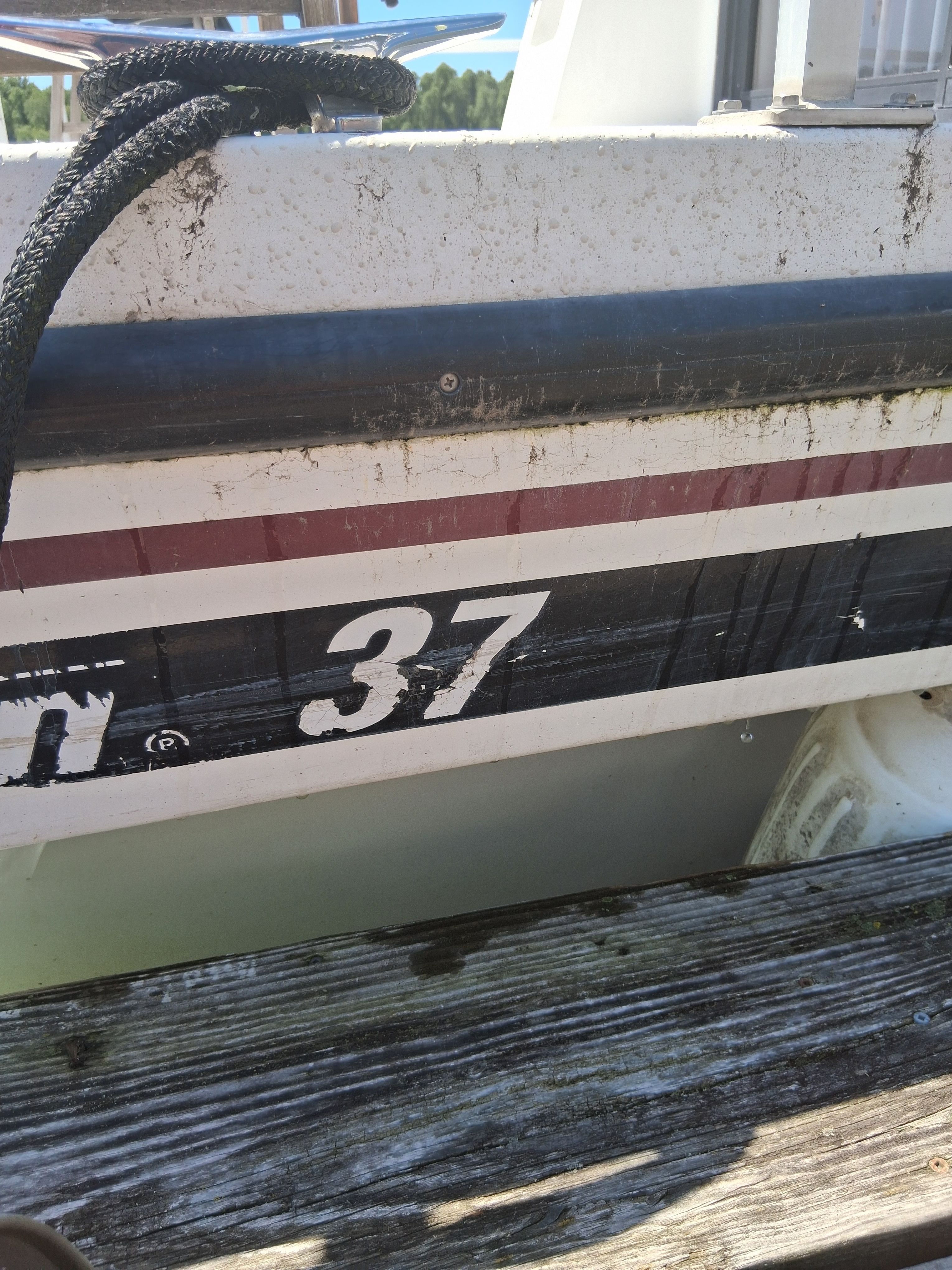 Close-up of a 1993 Gibson 370 Sport hull, showing stripes and the number 37.