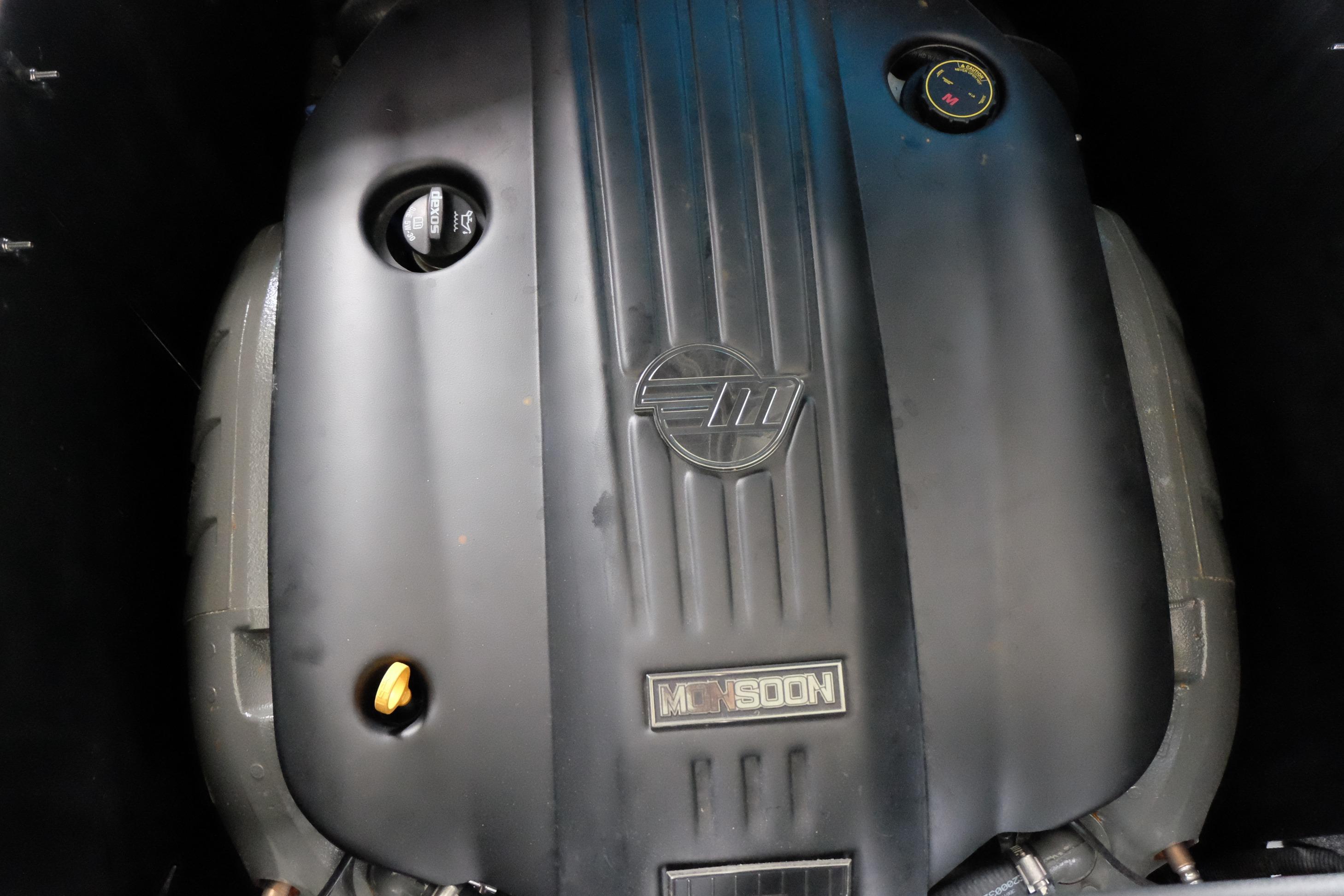 2020 Malibu Wakesetter 23 LSV engine, featuring Monsoon branding and sleek black cover.