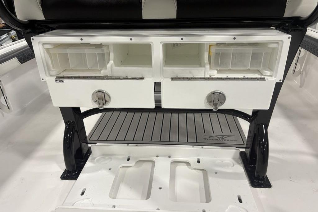 2026 Tidewater 2300 Carolina Bay boat storage compartments with secure latches and organized interior.