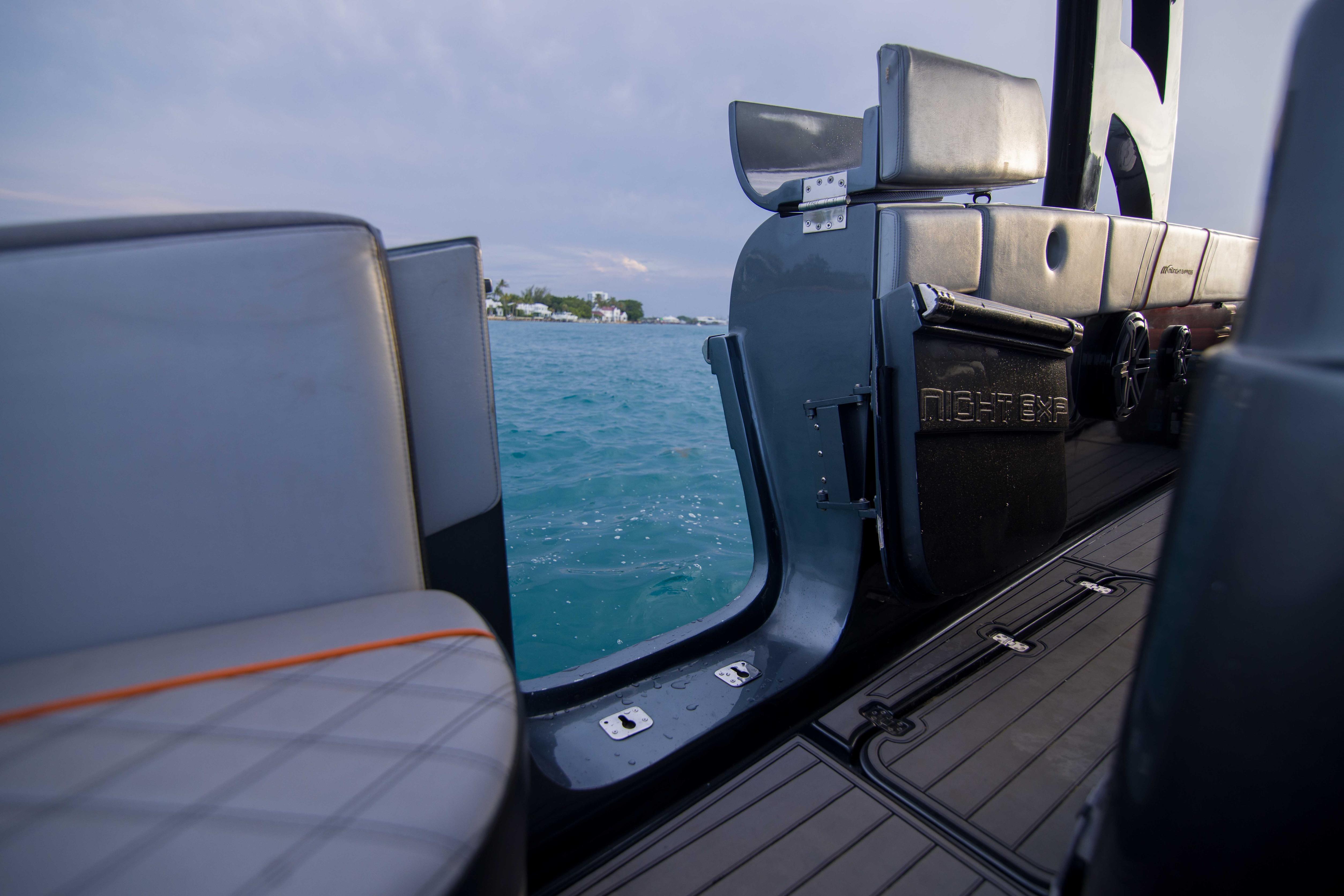 2019 Midnight Express 43 Open boat interior with open door, overlooking serene blue waters.